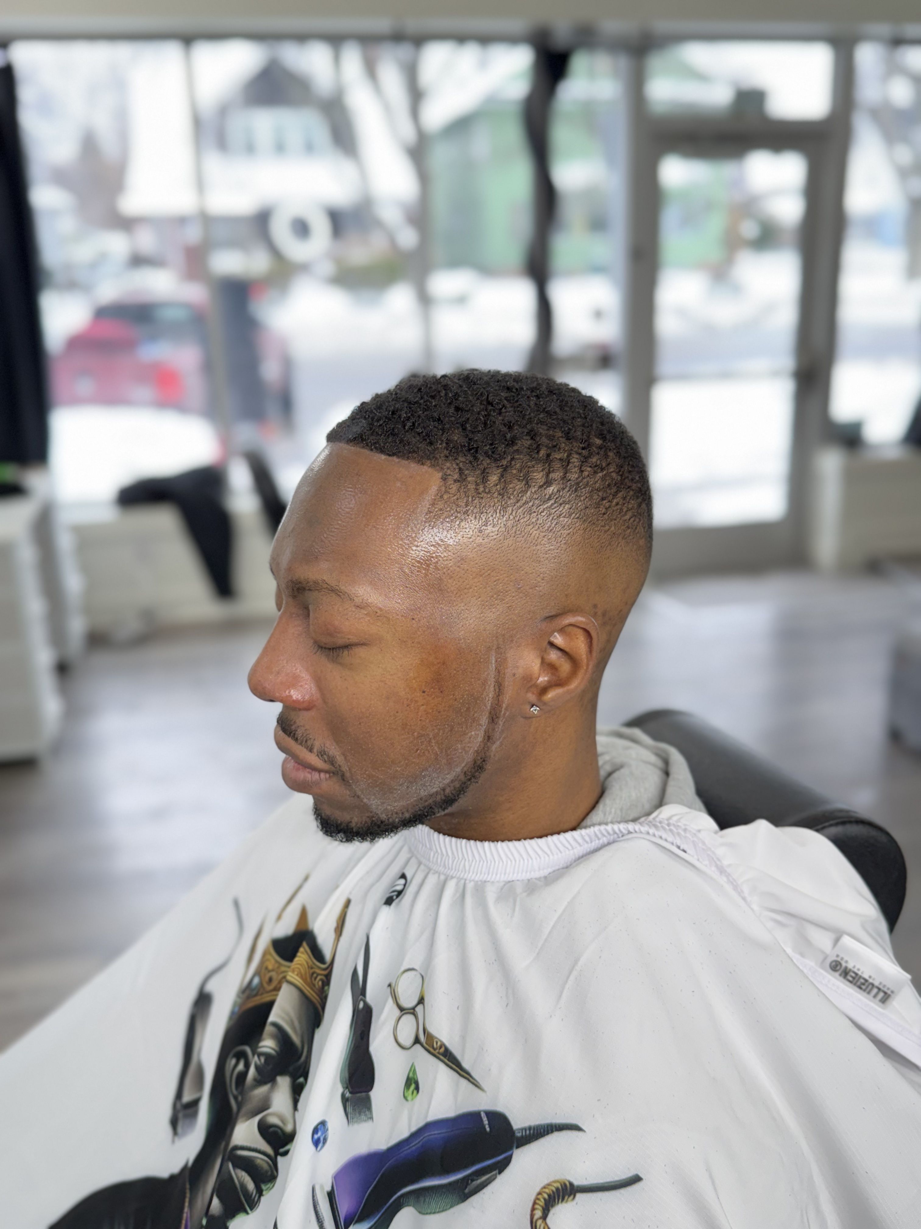 Clean skin fade haircut with sharp edges at Pure Masters Lounge Rochester NY