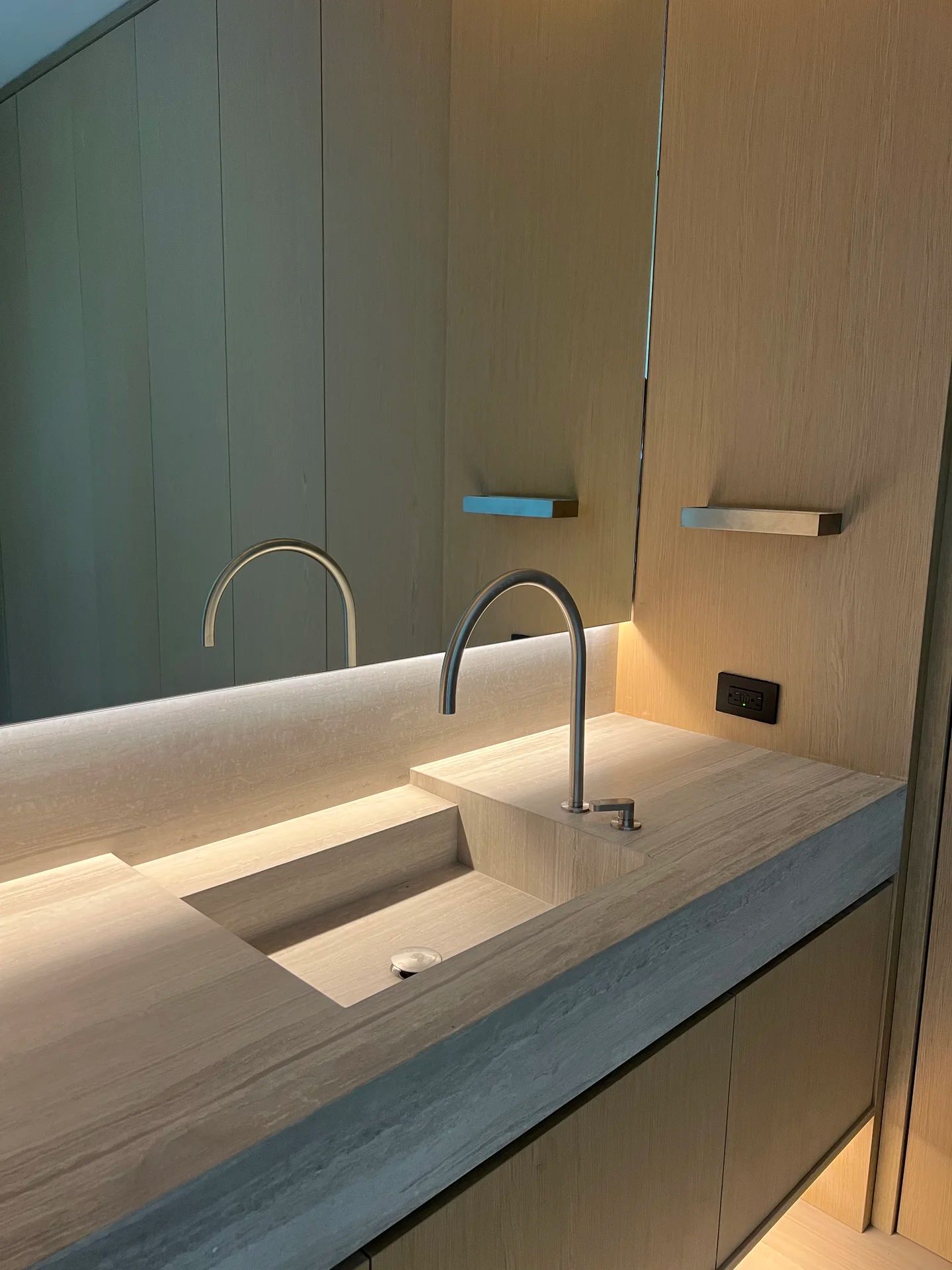 Luxury bathroom vanity with sleek faucet and designer hardware — PGKB