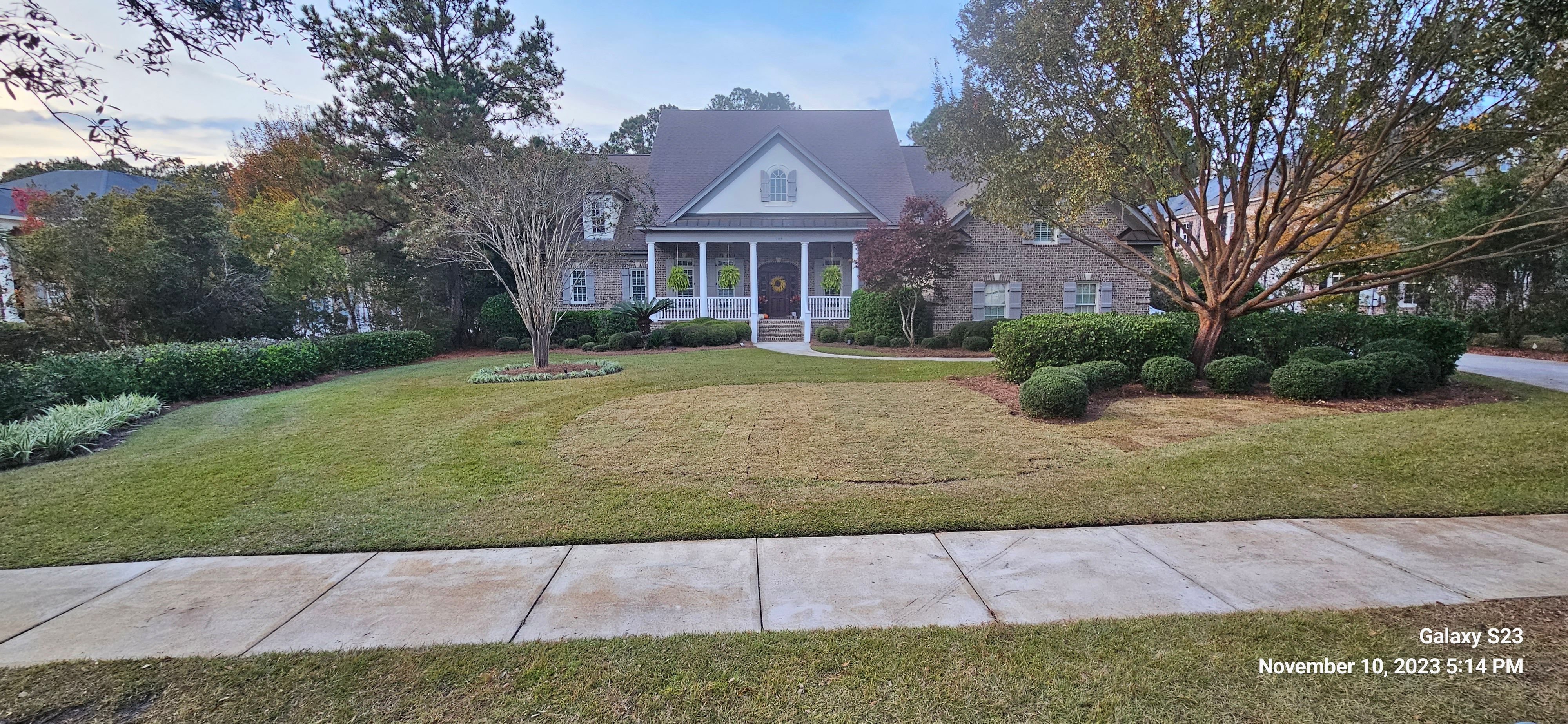Beautiful brick home with manicured lawn
