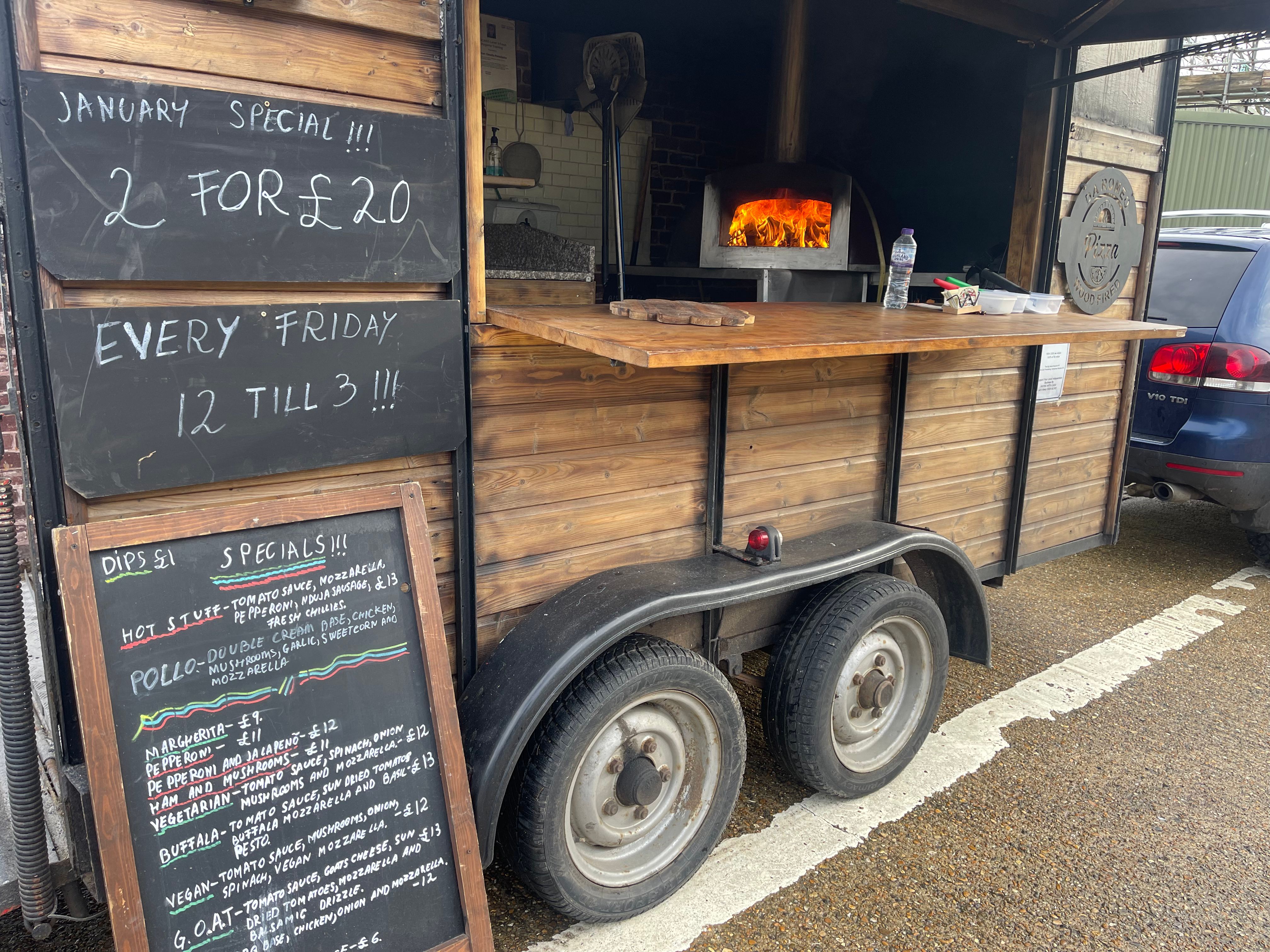 Da Romeo horse box with chalkboard menu and wood-fired oven