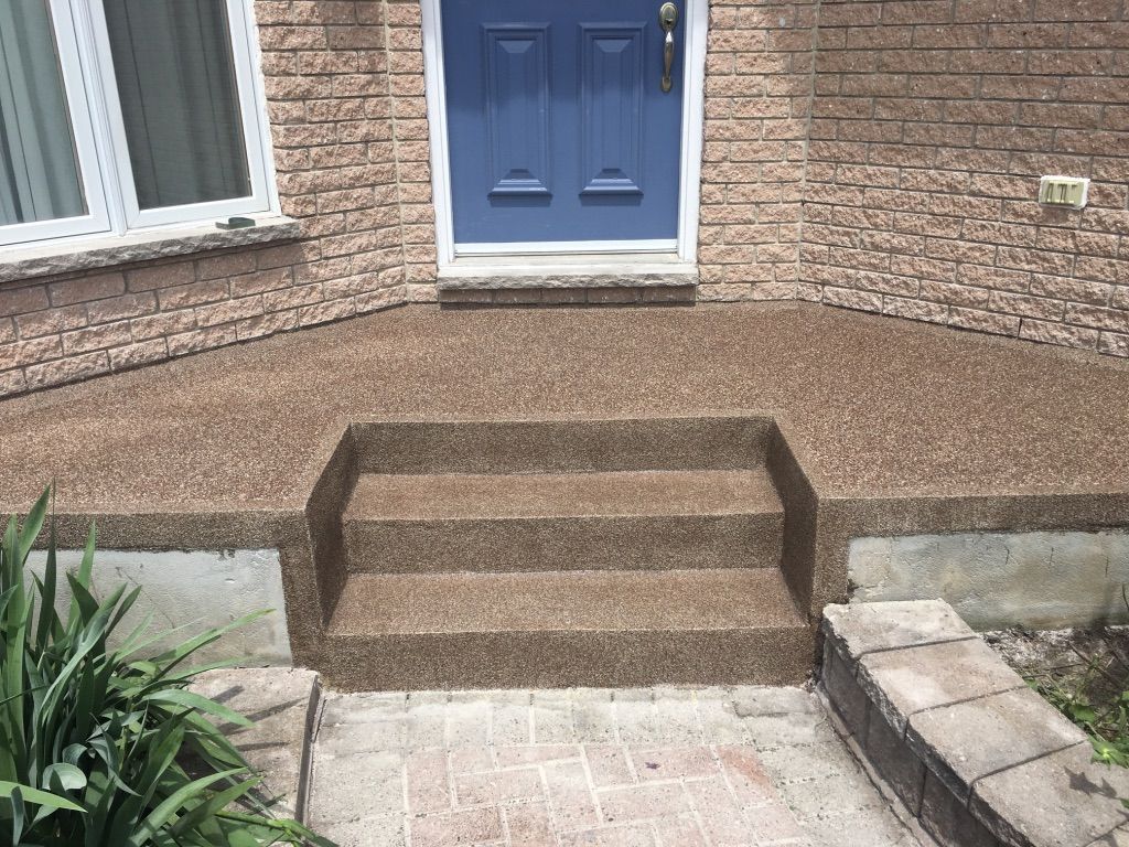 Exterior concrete steps and landing with rubberized polymer coating