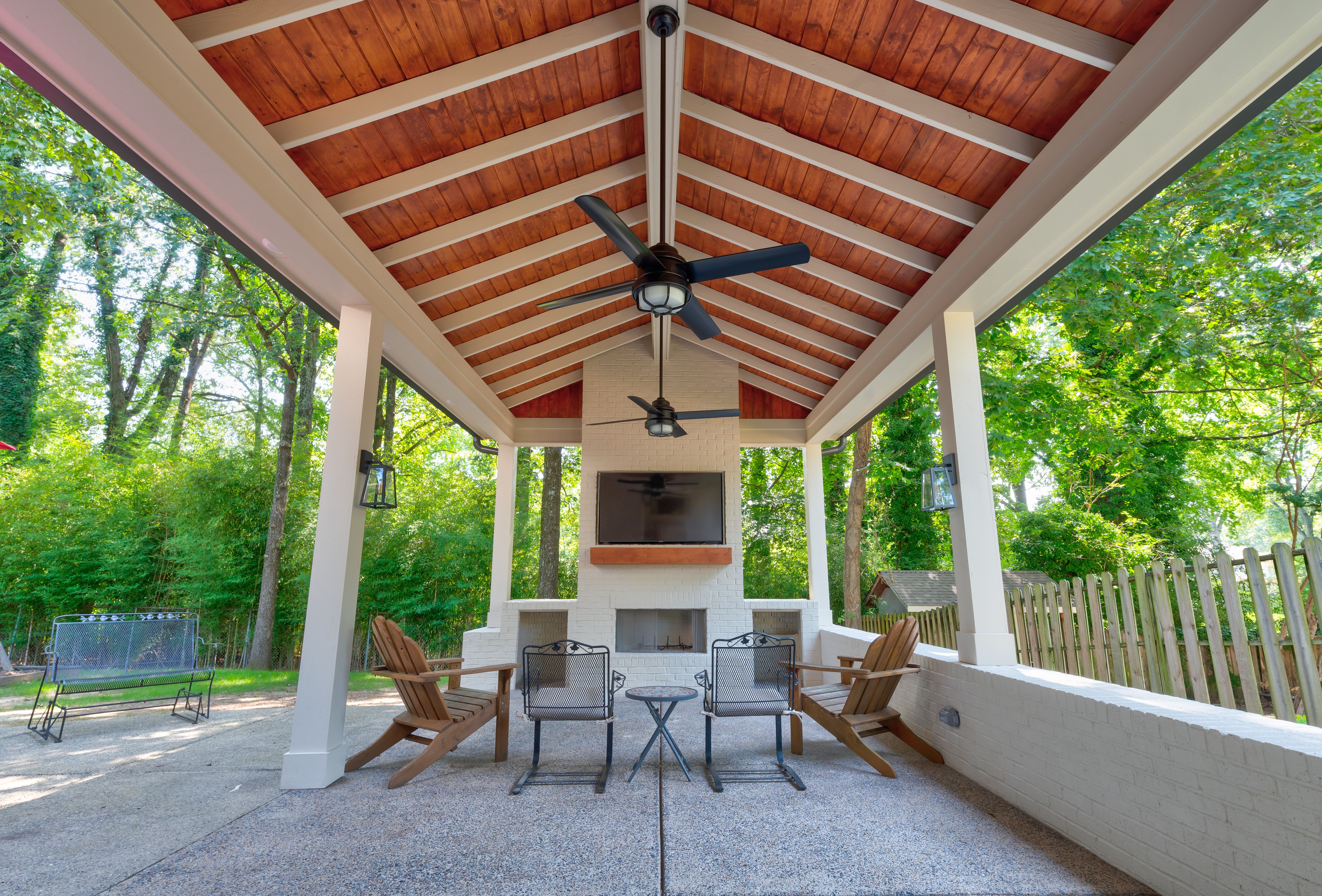 Outdoor patio with fireplace and seating area - Gardenia Residence