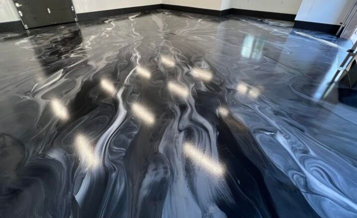 Black and gray marbled glossy epoxy garage floor by Eternal Resin