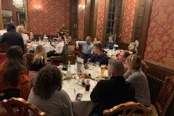 Corporate quiz night with teams competing at tables, hosted by Event Collection UK