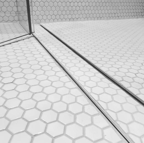 Tile insert grate detail with hexagonal tiles