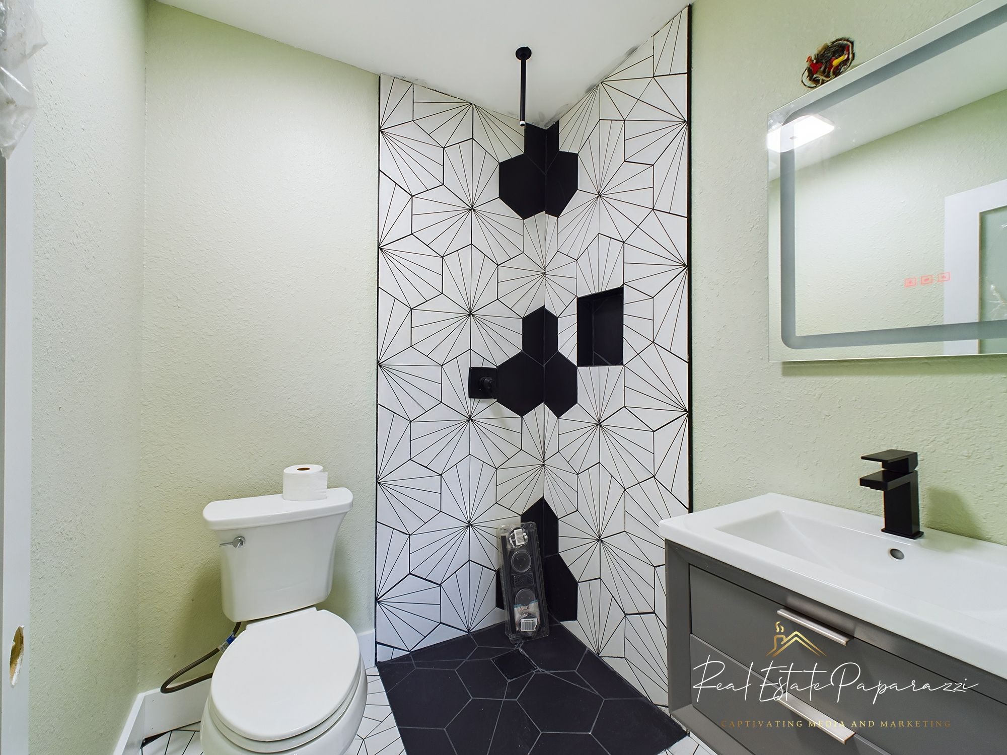 Acre Holdings renovated bathroom with geometric tile — Townsend BLVD, Jacksonville FL