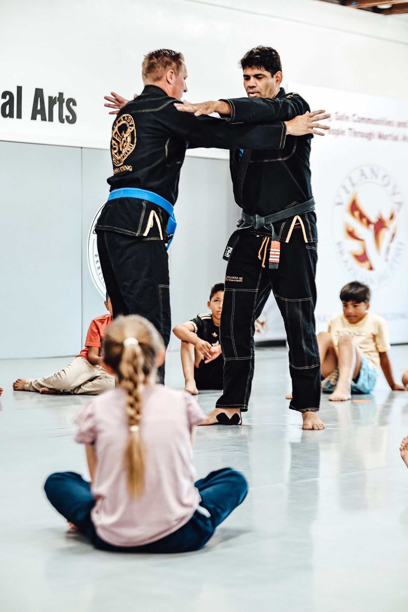 Instructors demonstrating technique while students watch during field trip