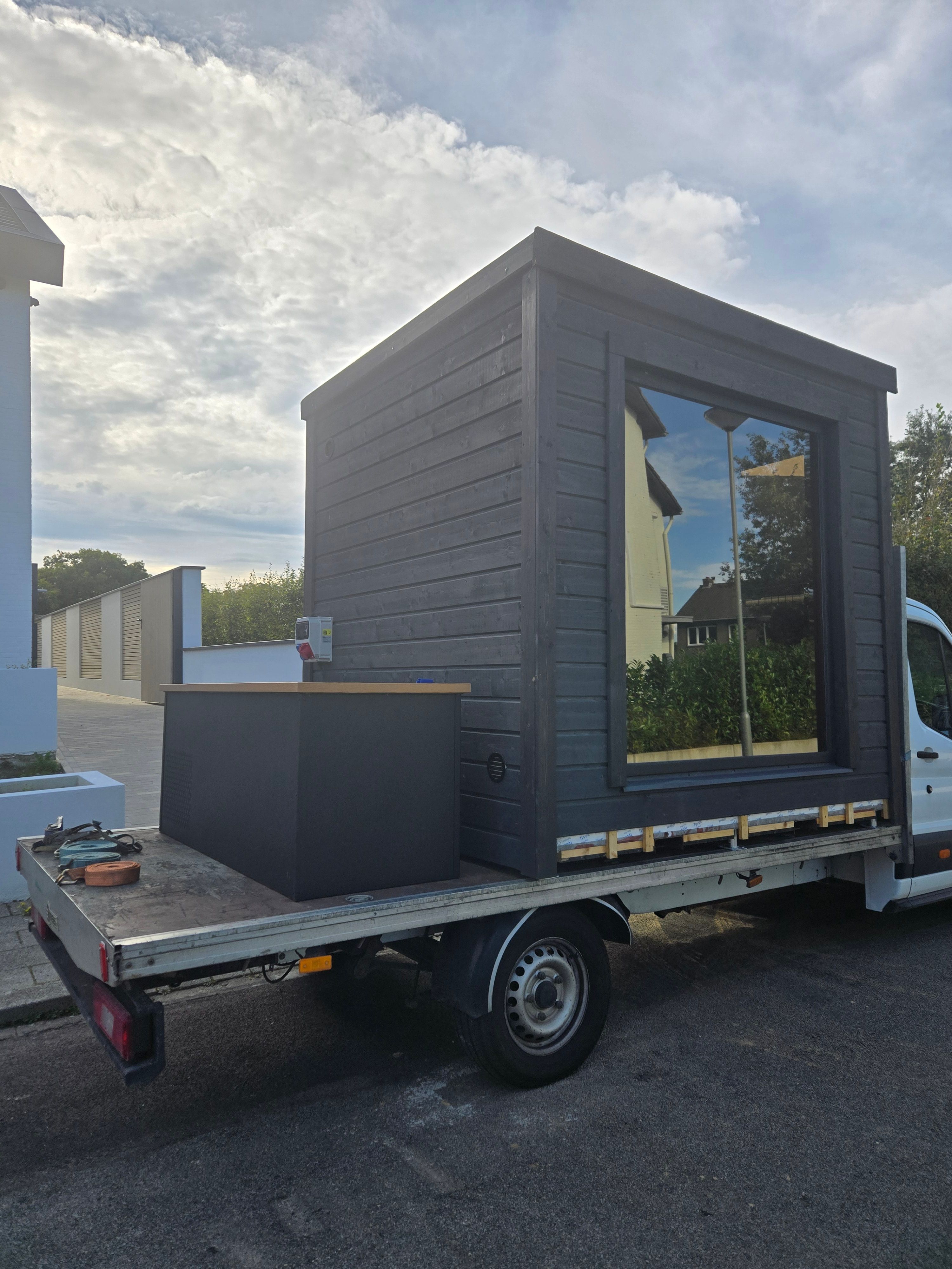 Medi-Spa flatbed truck loaded with unit for delivery