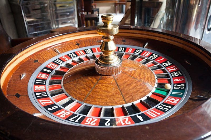 Professional casino night with roulette tables and croupiers at a corporate event by Event Collection