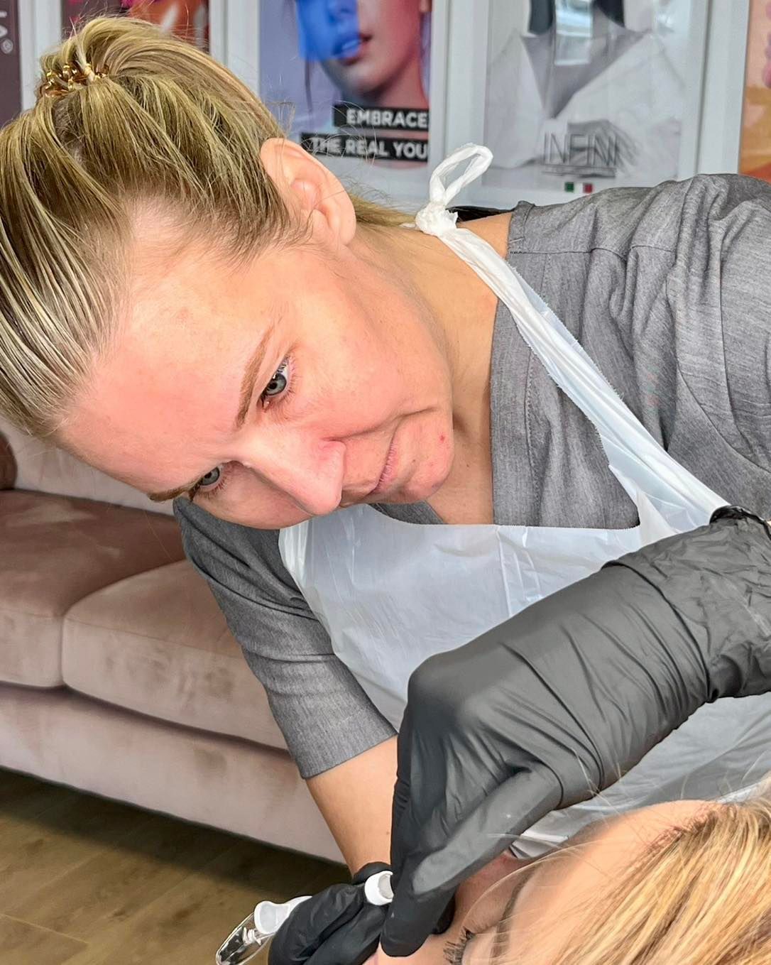 Lyndsey performing a close-up facial treatment