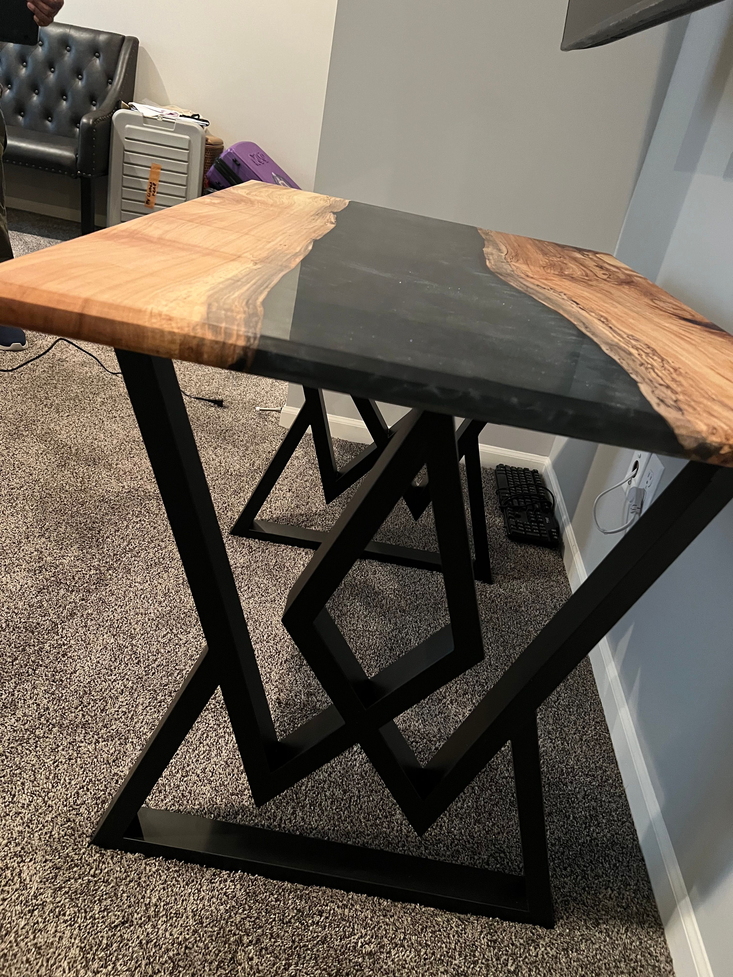 River table with wood and black resin on geometric metal base