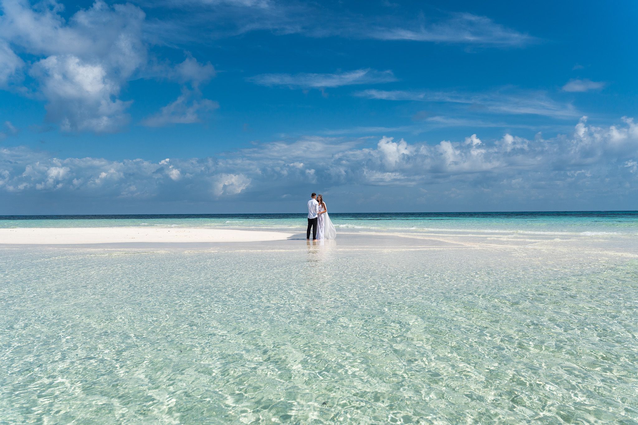 Couple on sandbank with turquoise water panorama - Zanzibar experience