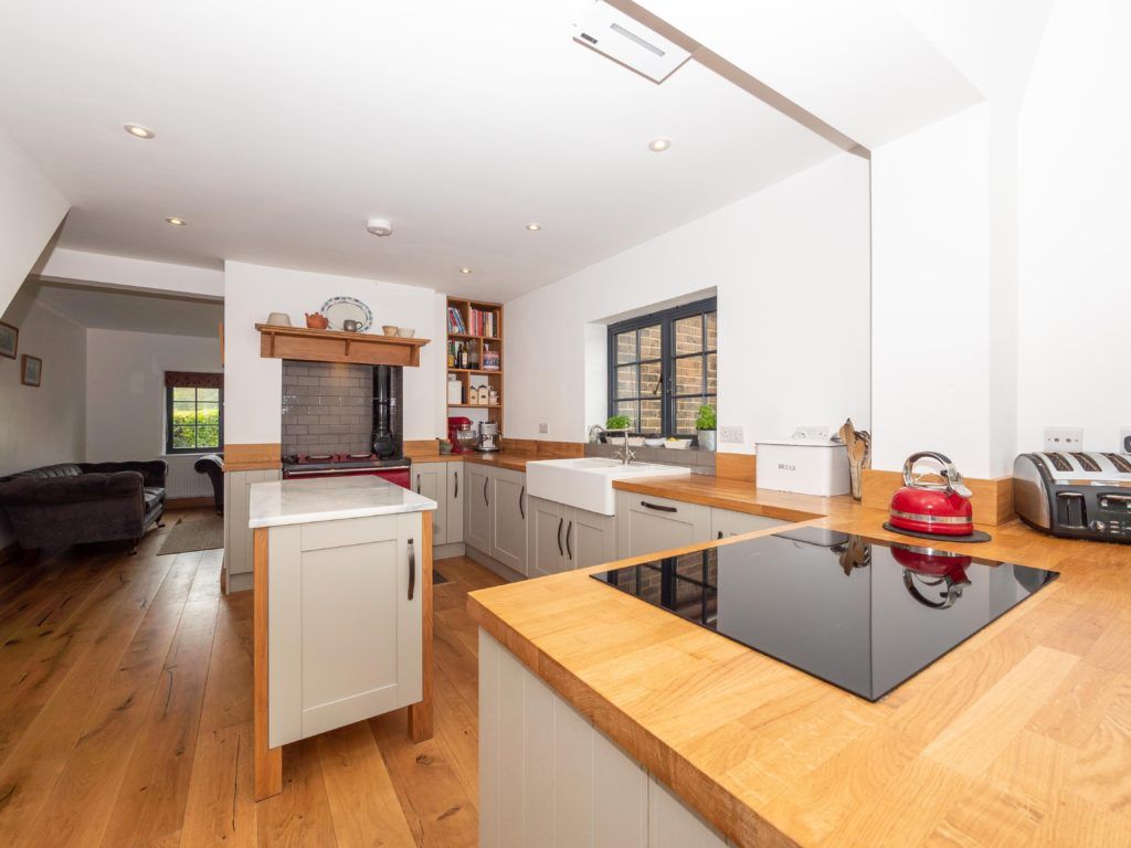 Modern kitchen interior with marble island — property photography East Sussex