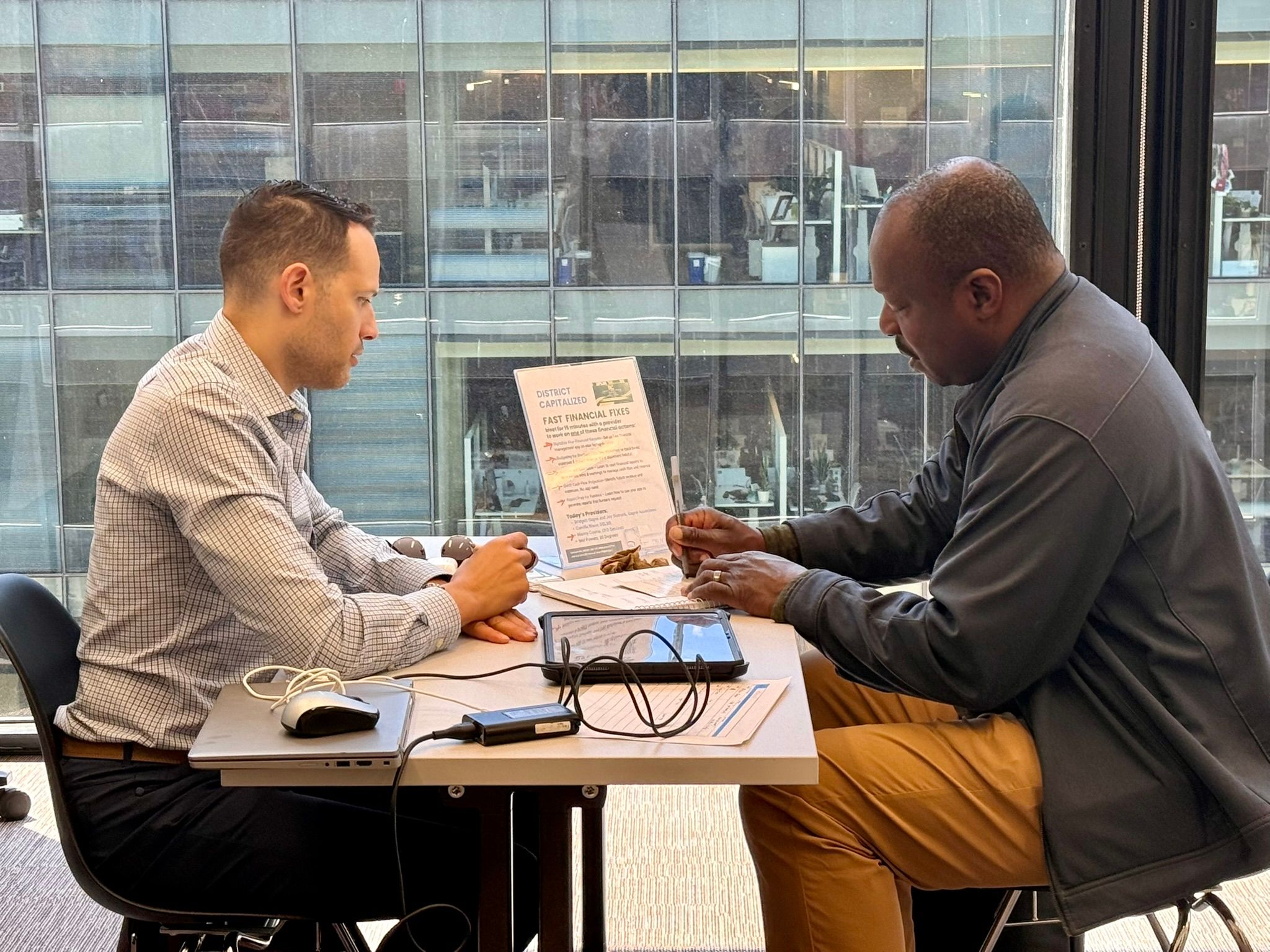 Manny Cosme consulting with a law firm client