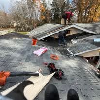 Del Cid Construction crew installing roofing shingles on residential home Pittsburgh PA