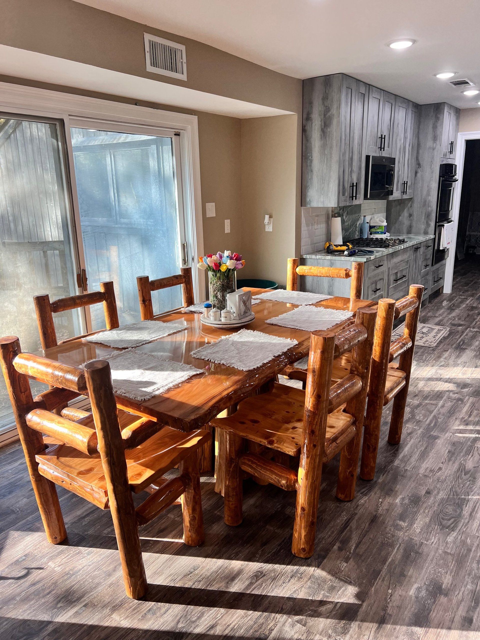 Live edge cypress dining table with natural edge in modern kitchen Northshore Louisiana
