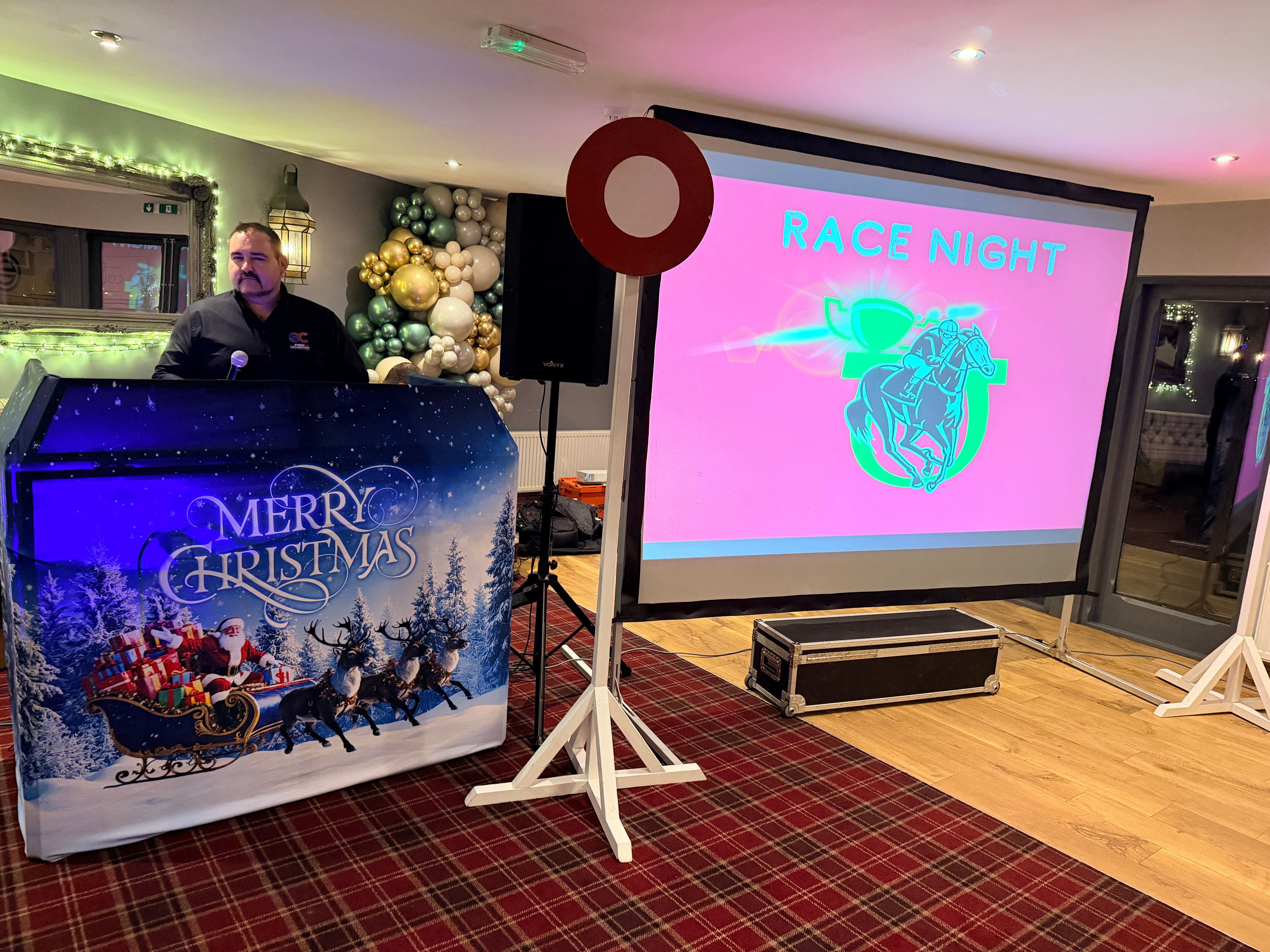 Corporate race night event with horse racing screens and live commentary organised by Event Collection UK