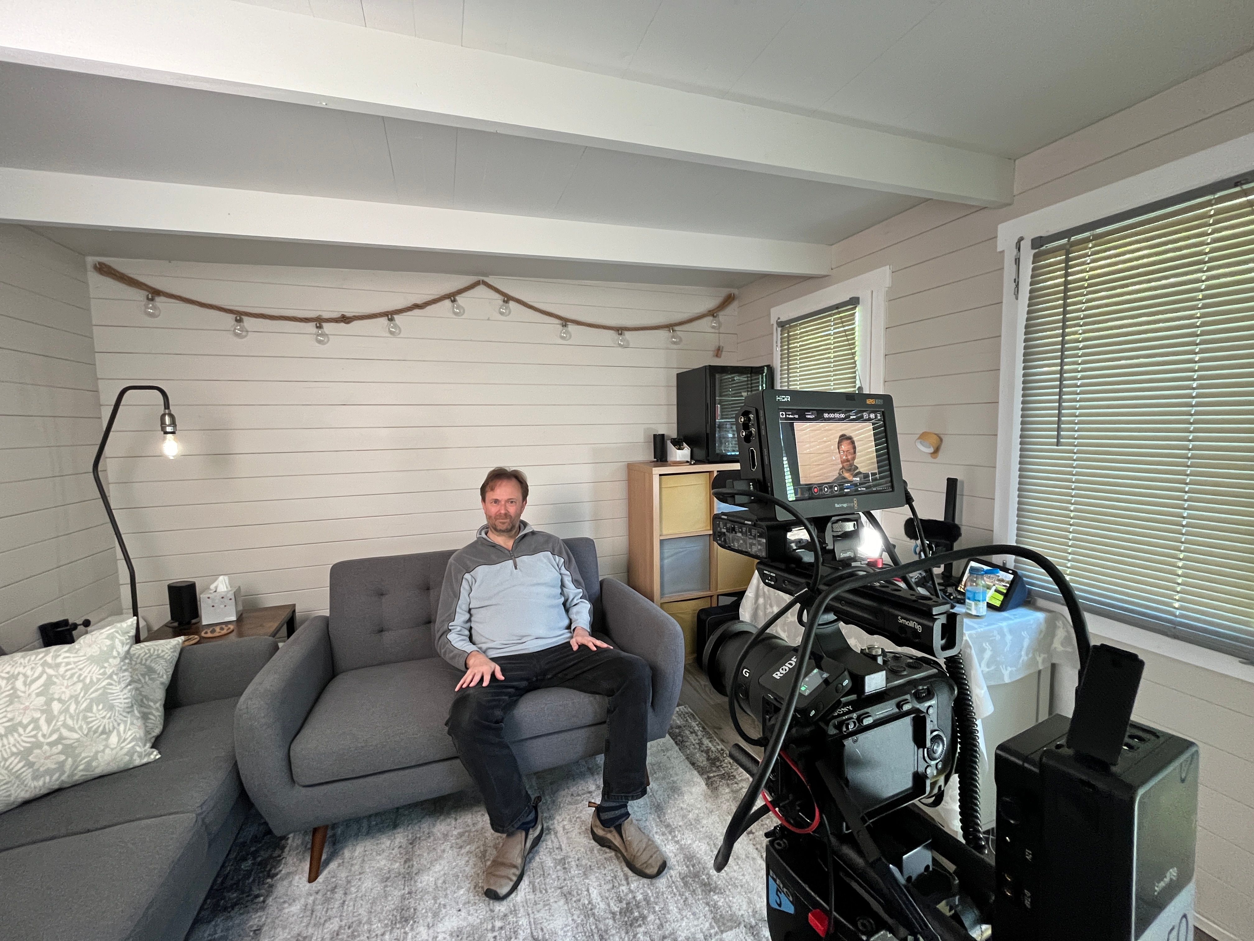 Client on set during a video shoot with camera equipment