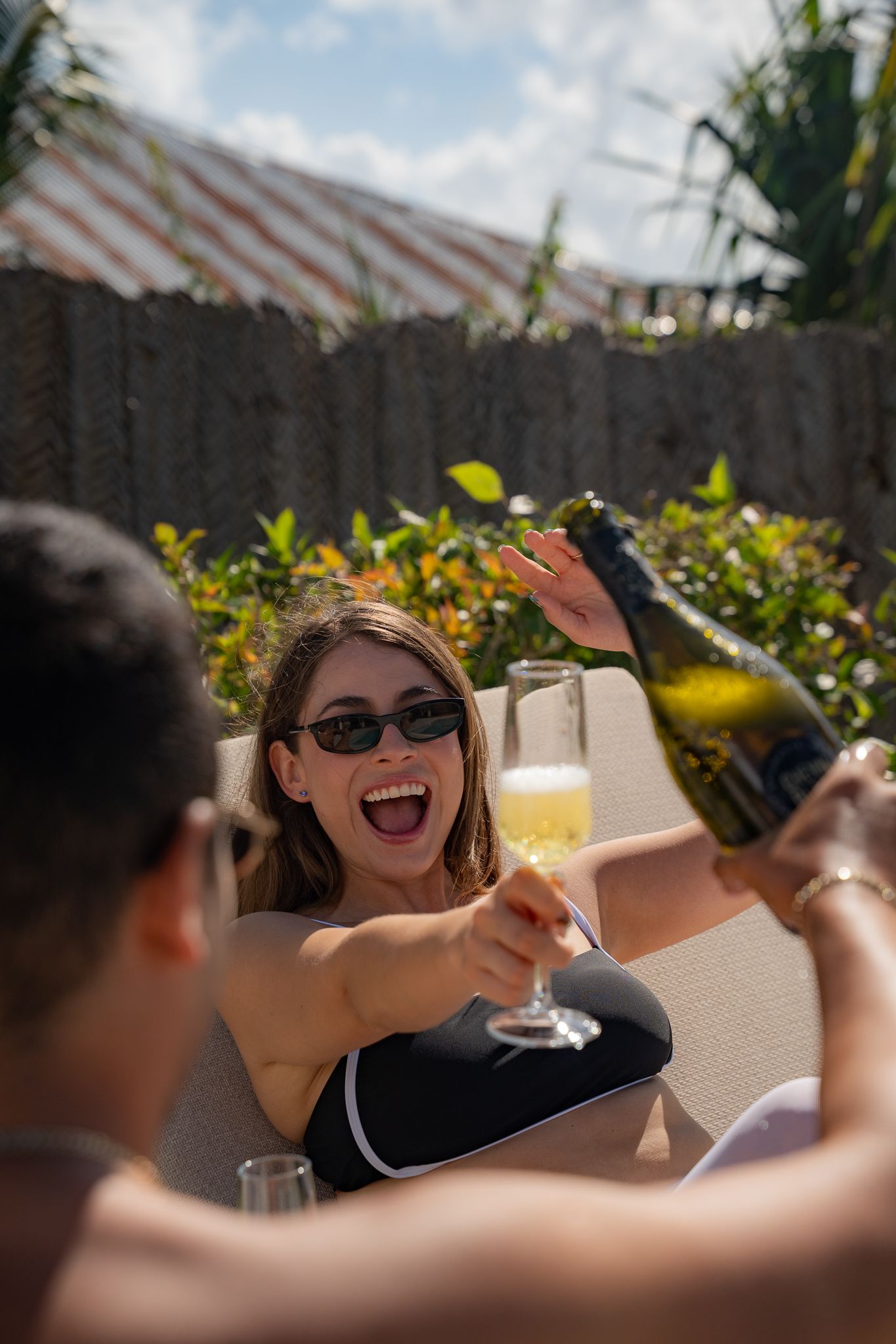 Champagne celebration during photoshoot — fun spontaneous Zanzibar photography