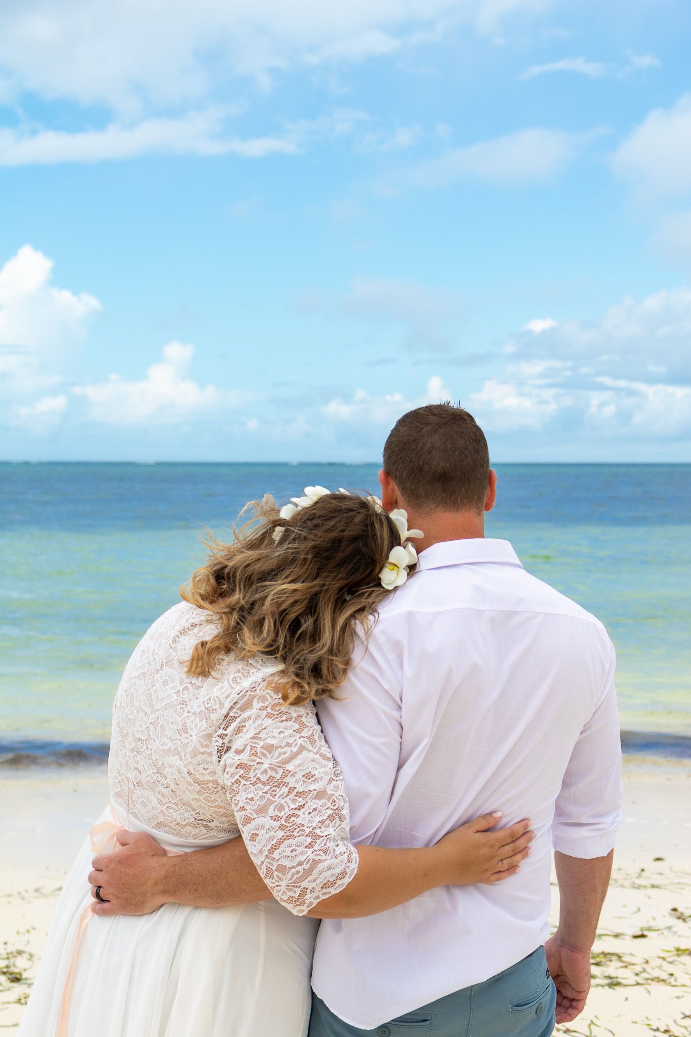 Couple on the beach in white dress, Zanzibar vacation photoshoot