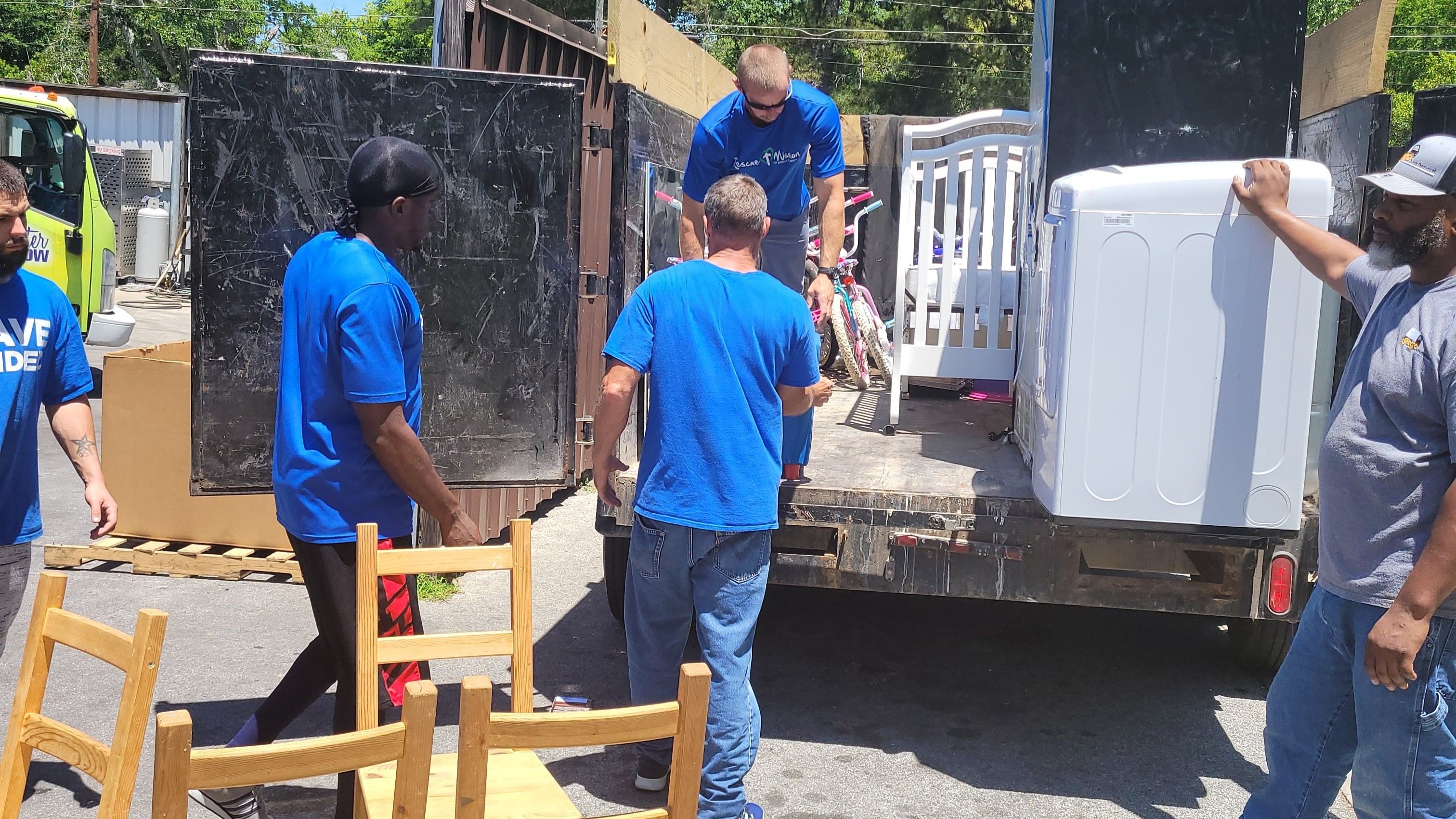 Furniture removal and appliance removal in Metro Atlanta by GoGo Junk Removal team loading bulky items
