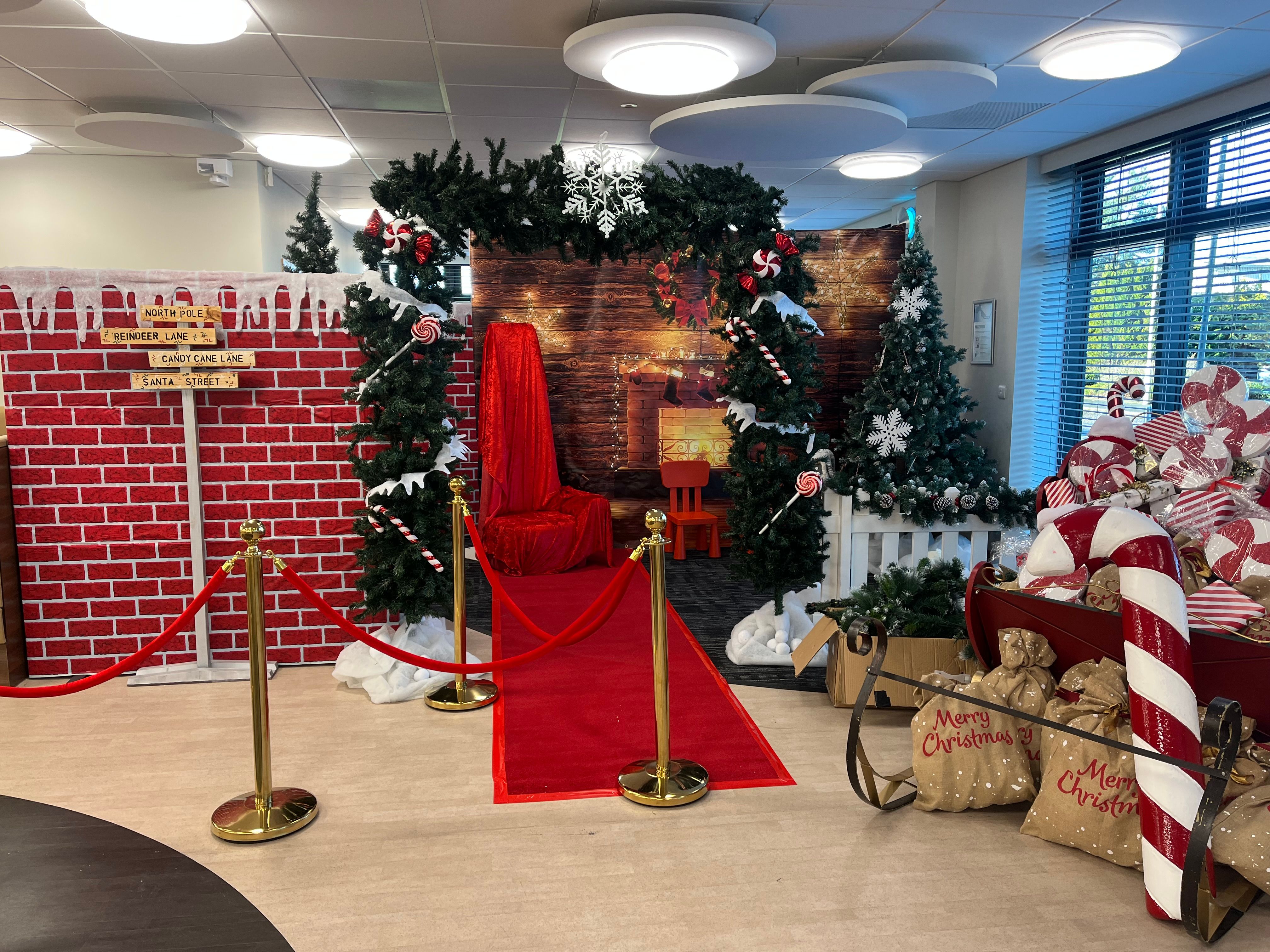 Christmas-themed corporate party setup with festive decorations, candy canes and seasonal displays organised by Event Collection