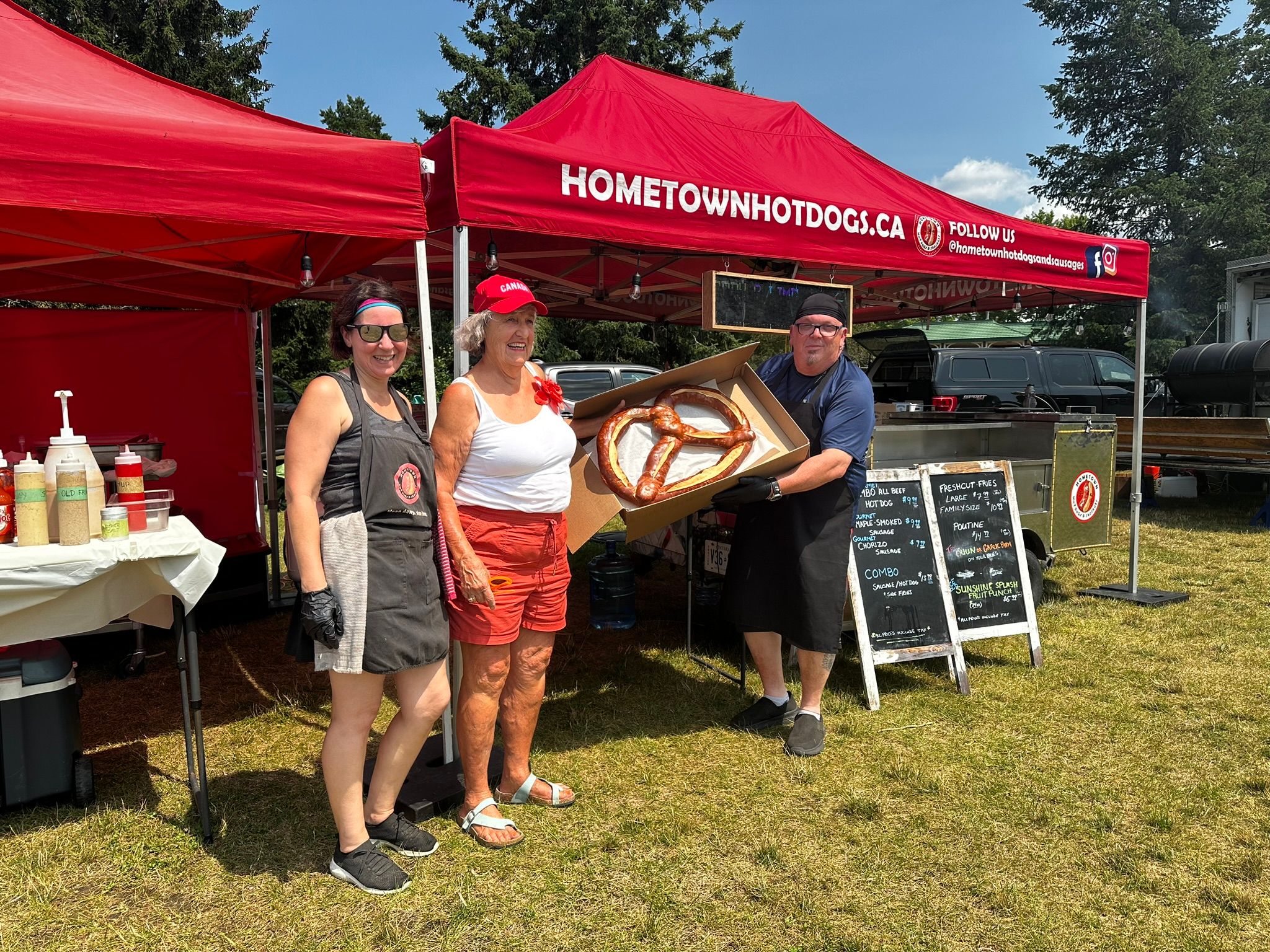 Team posing with a giant pretzel