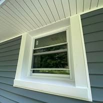 Clean siding installation with window trim detail on residential home