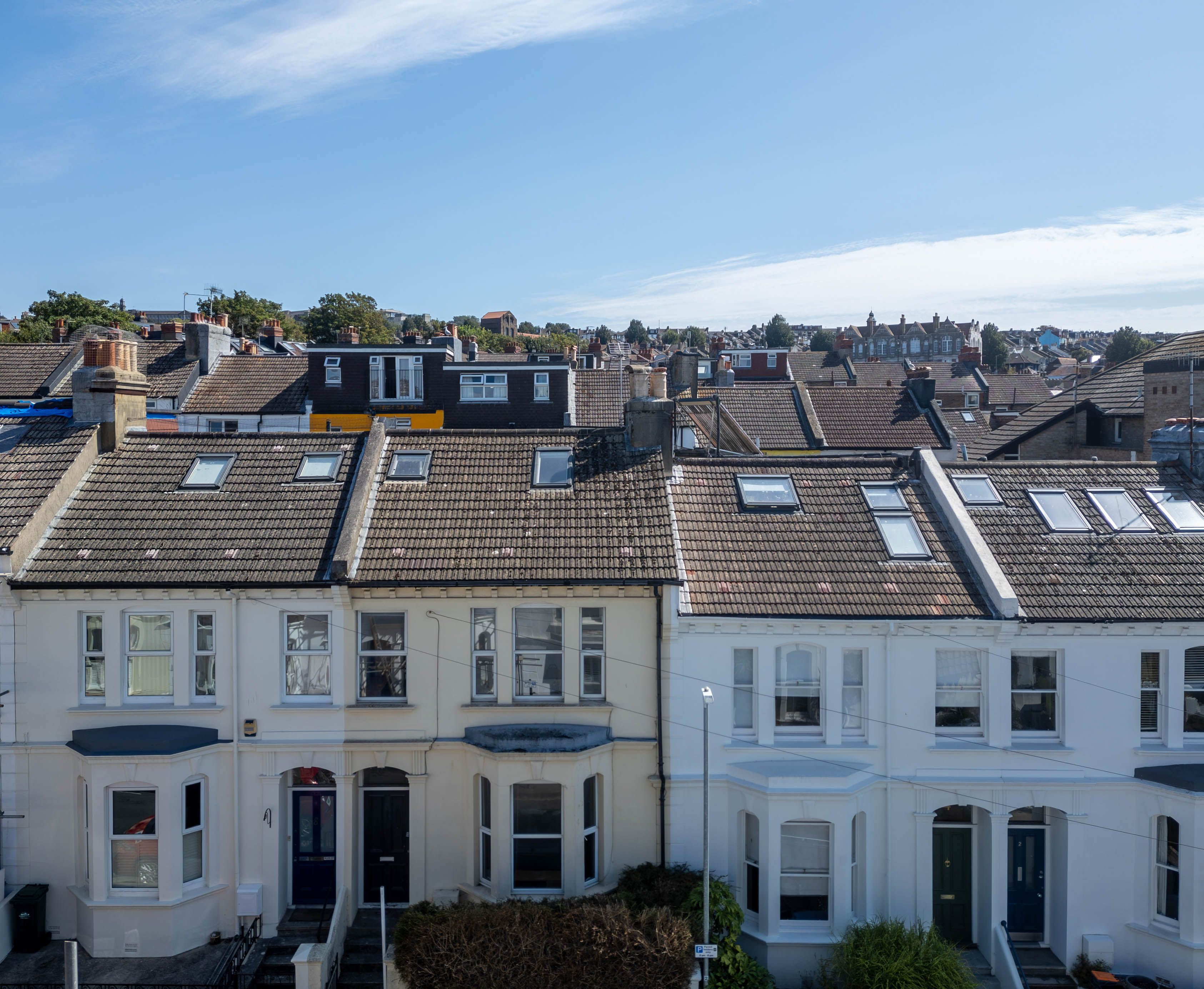 Row of residential houses with tiled roofs photographed by Stephen Cowles Photography
