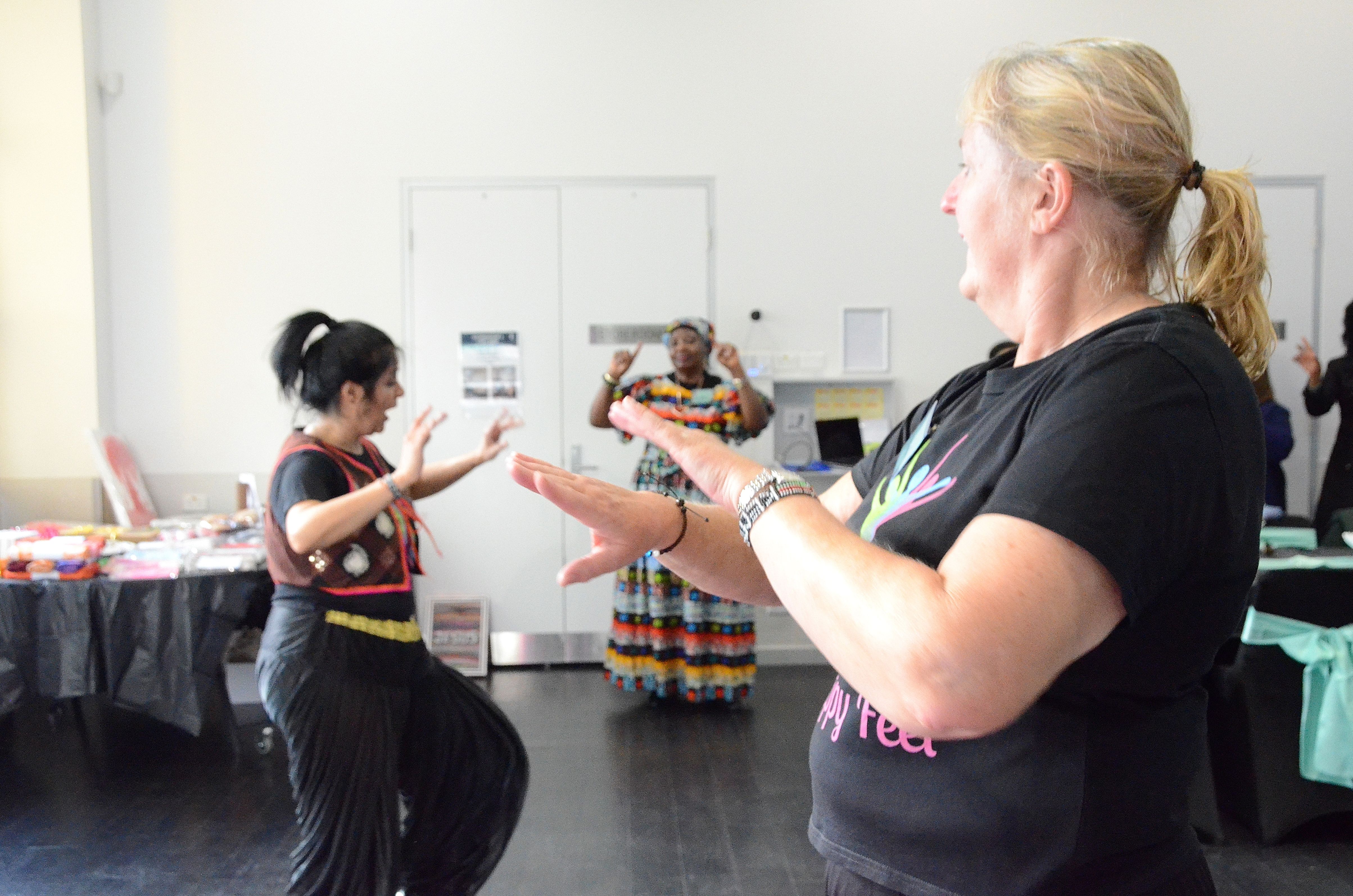 Women enjoying a fitness and dance session at E-Girl Empowerment workshop
