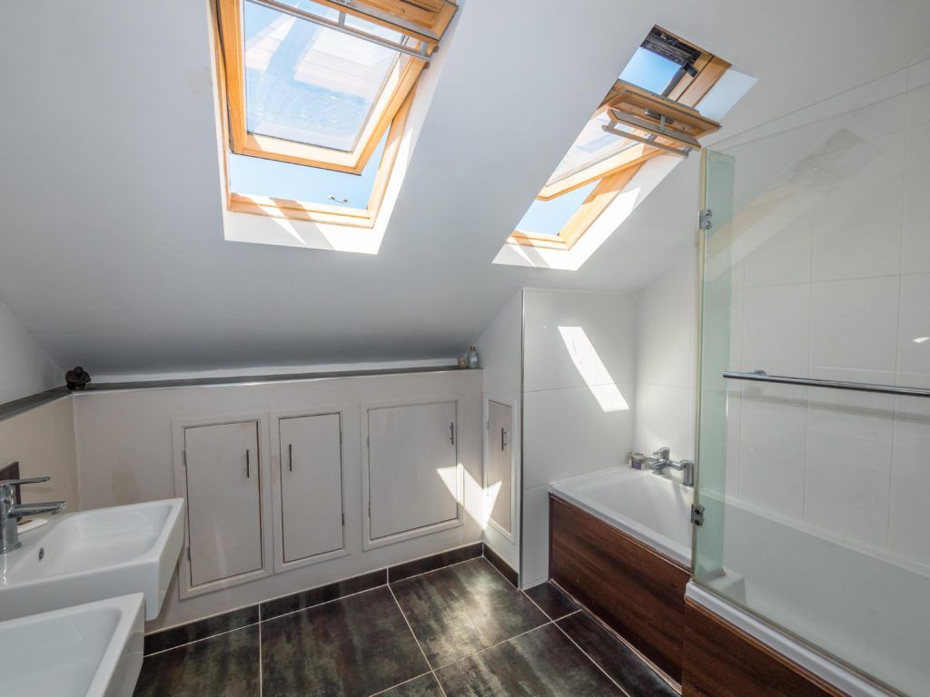 Modern bathroom with skylights — interior property photography