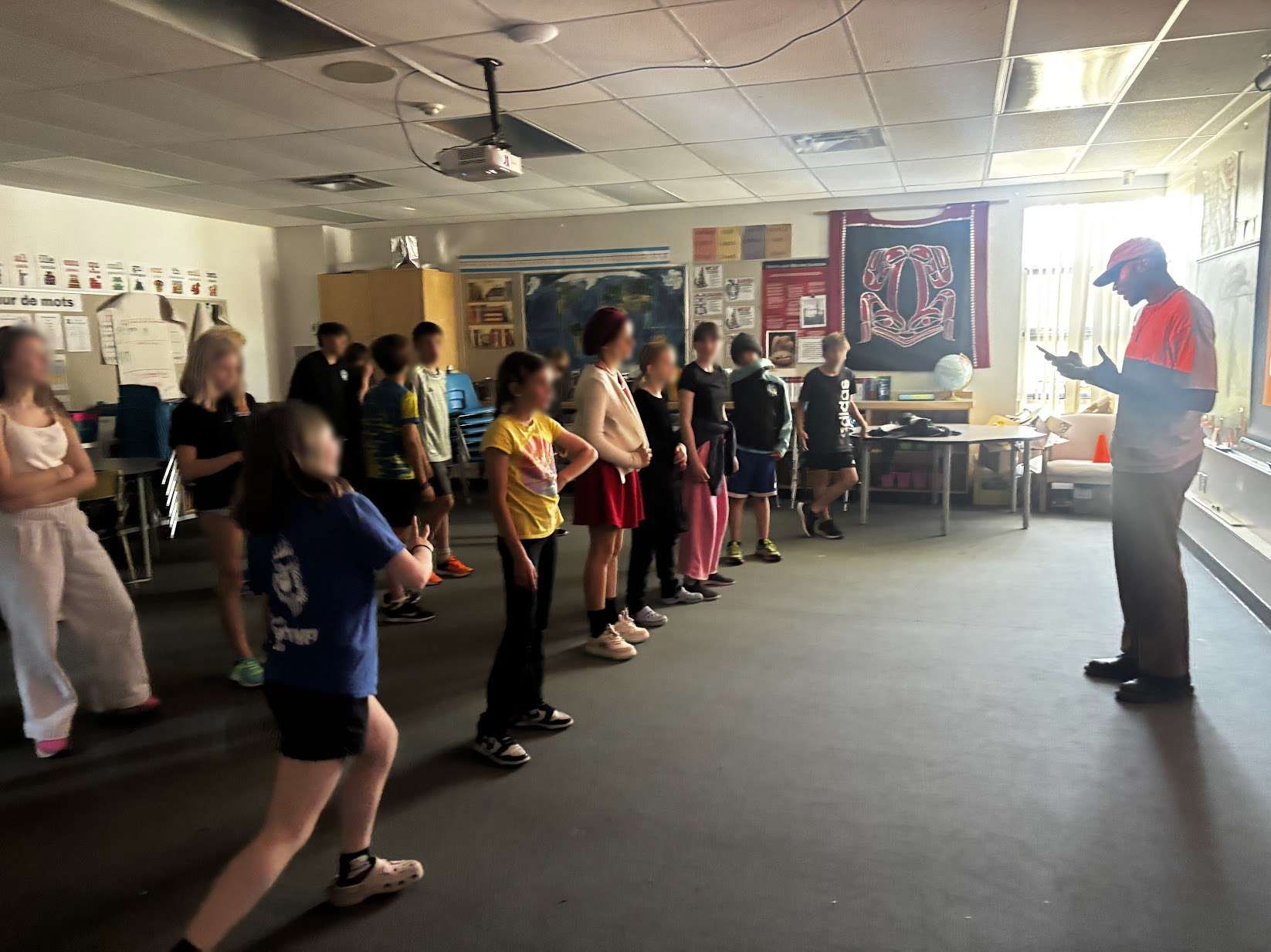 Ivan instructing a group of students in a classroom during a Groove session