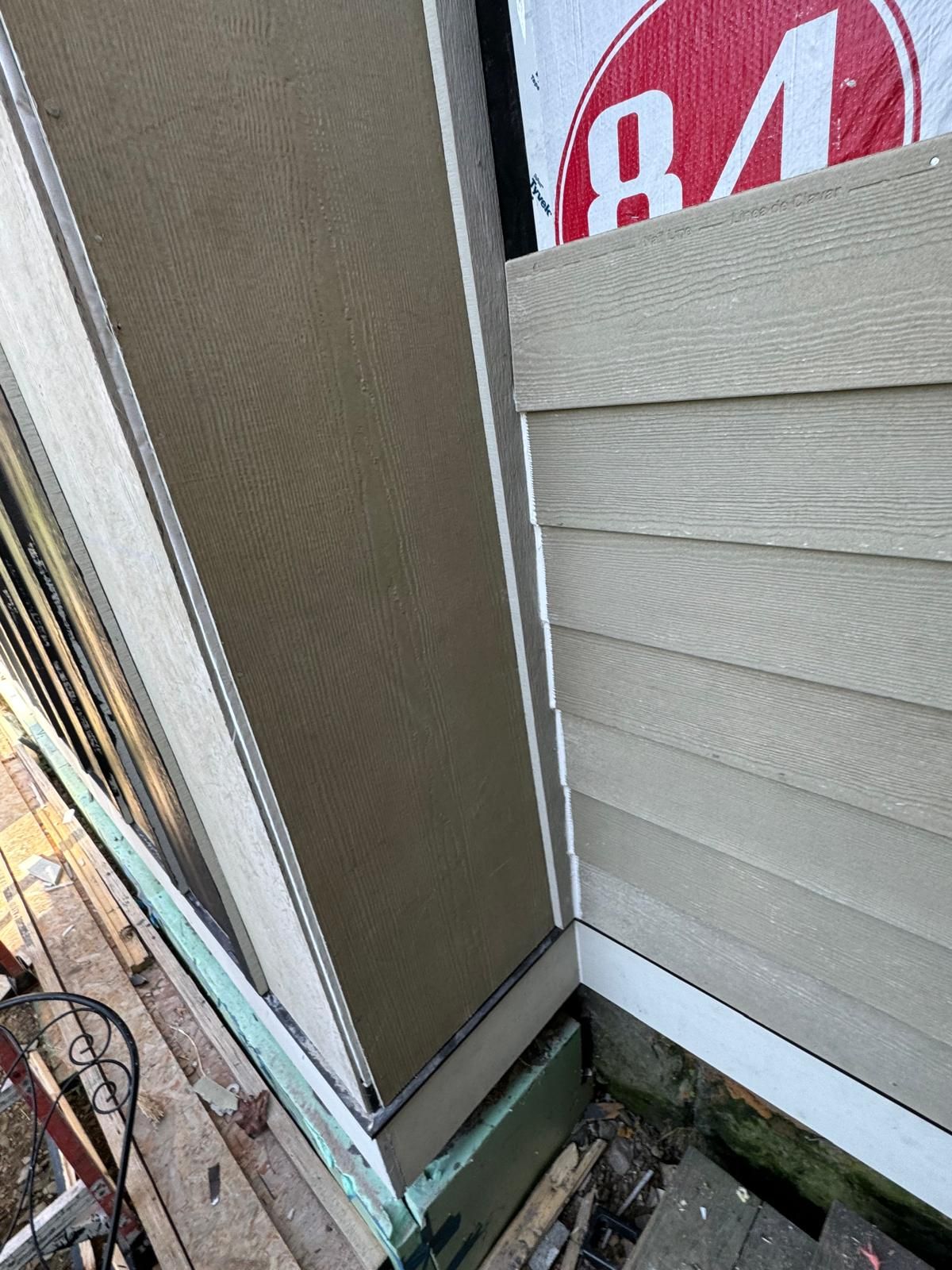 Close-up of siding corner detail showing precision installation work