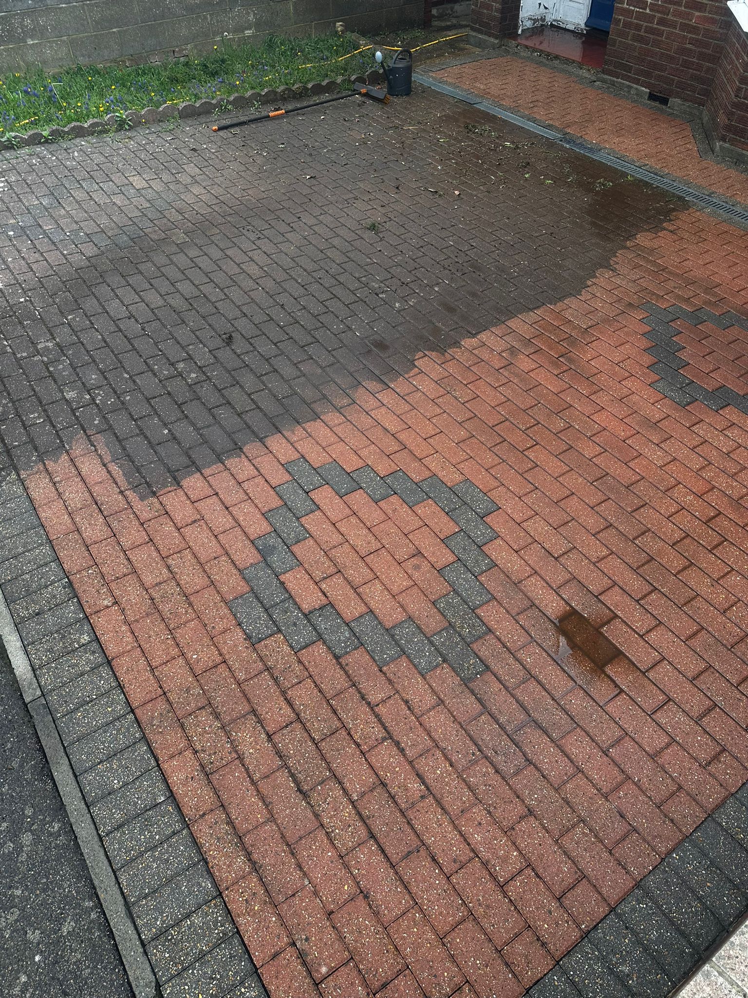 Driveway cleaning in progress showing before and after