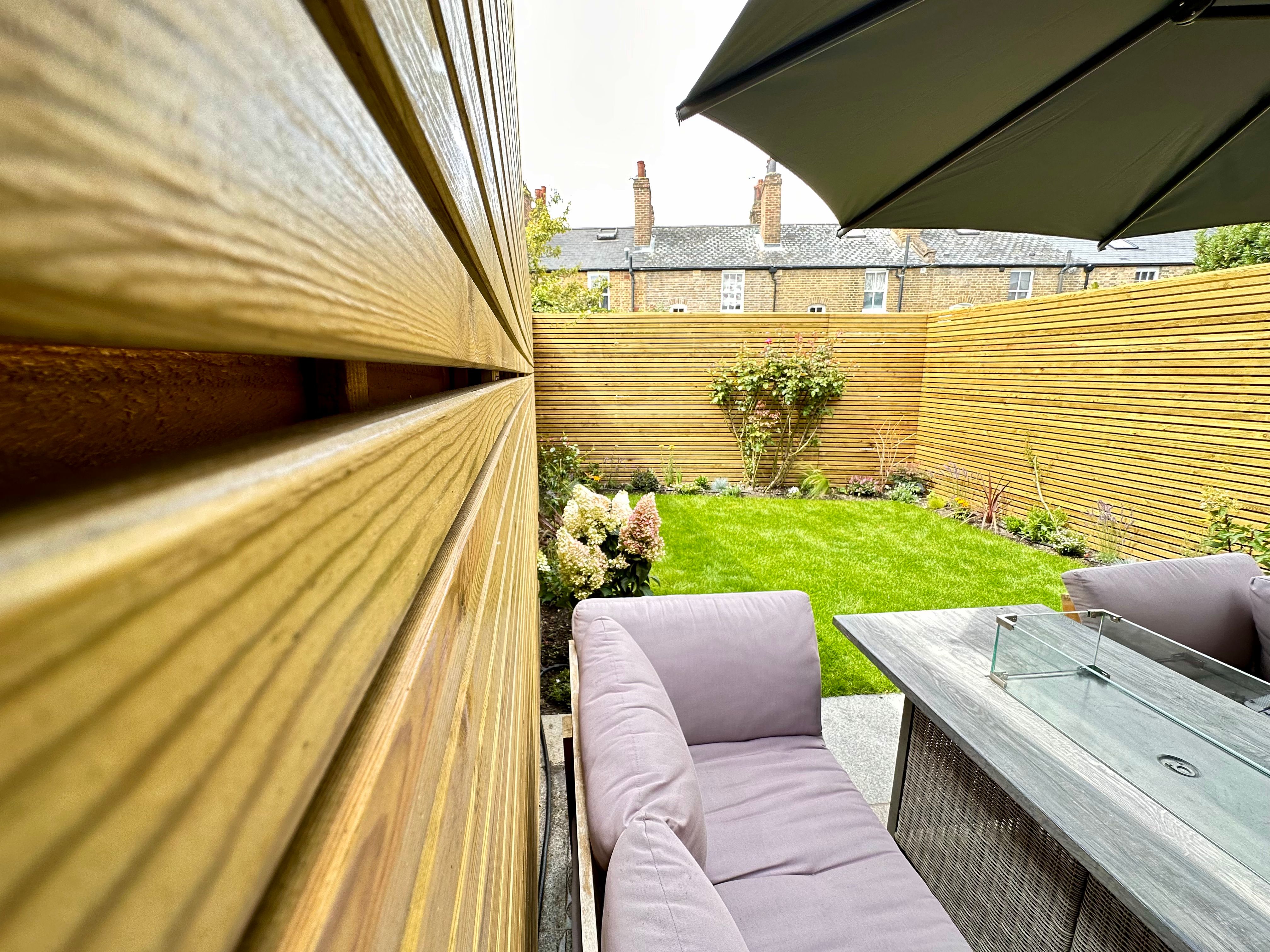 Porcelain patio with seating wall detail in Blackheath garden — Wicked Gardens LTD
