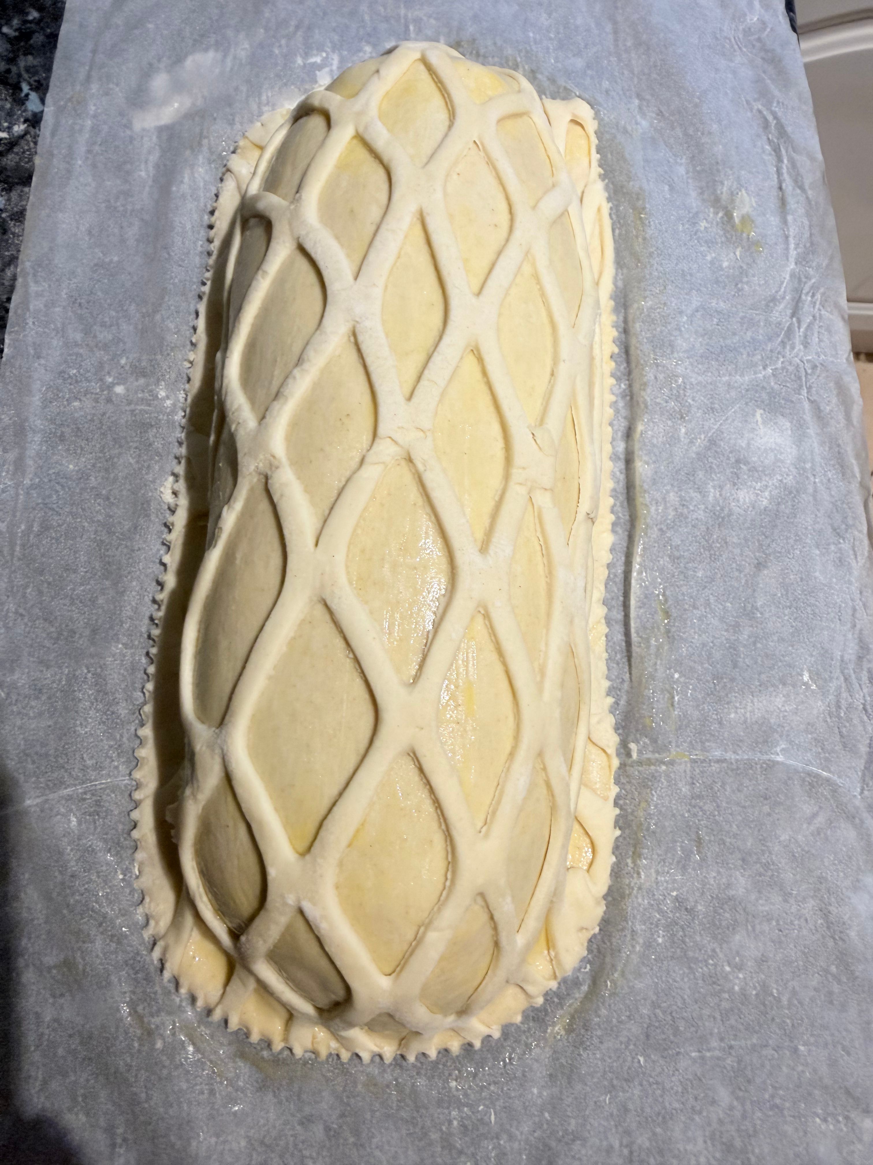 Beef Wellington with lattice pastry, ready for the oven