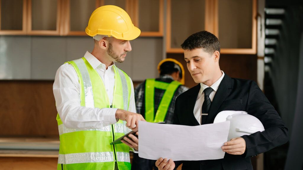 APX Construction team reviewing plans