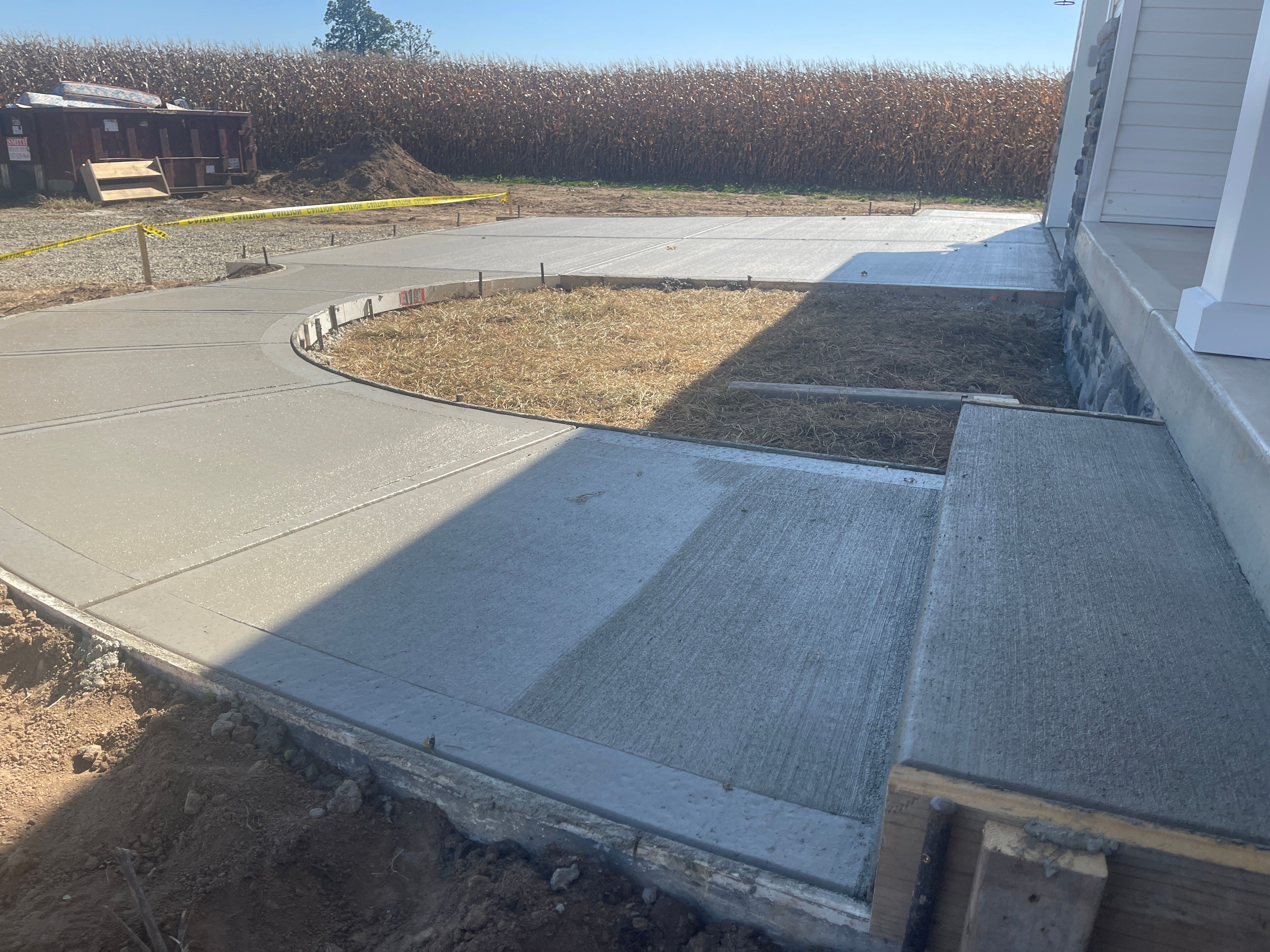 New concrete sidewalk and steps next to a building in Central Ohio
