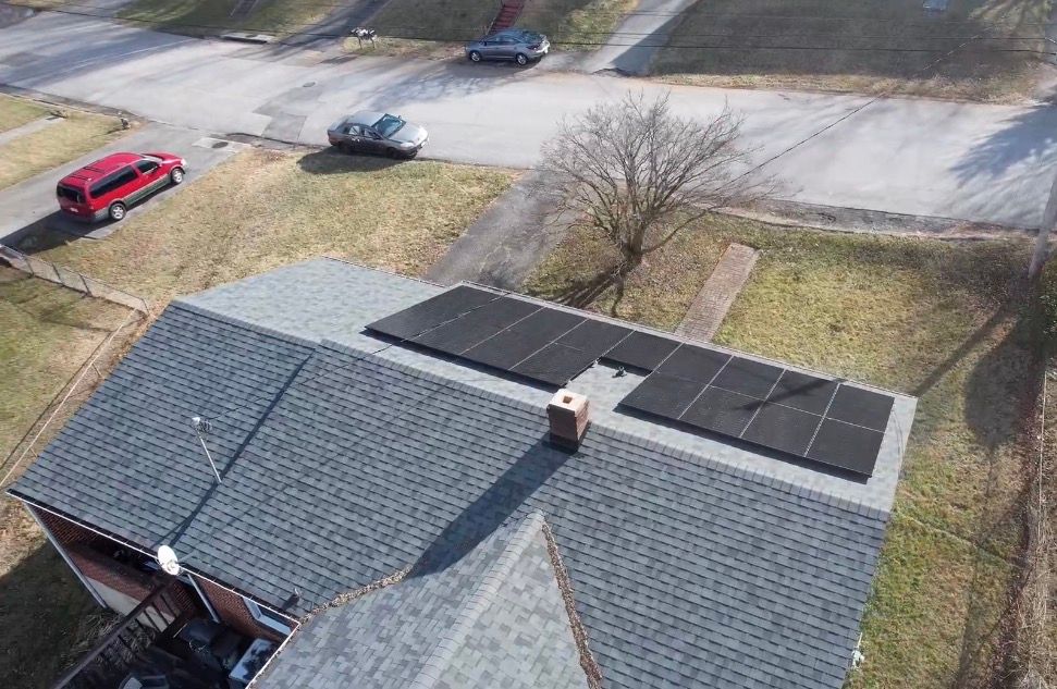 Finished solar project — aerial view of home with solar panels
