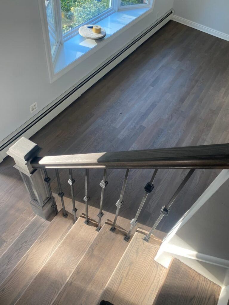 Staircase refinishing with hardwood treads in Rockford IL