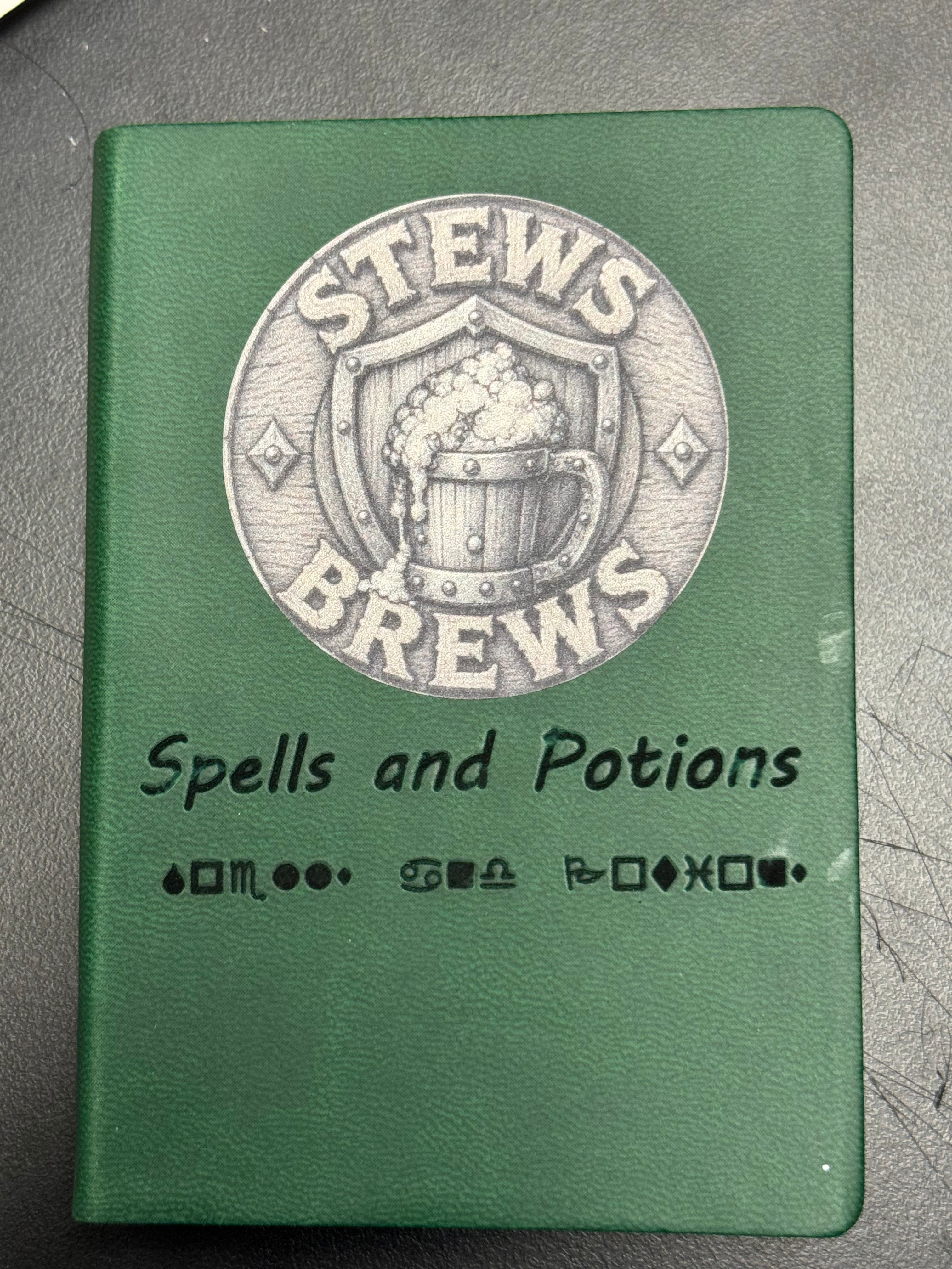 Spells and Potions pocket notebook — soft cover faux leather with Stews and Brews emblem