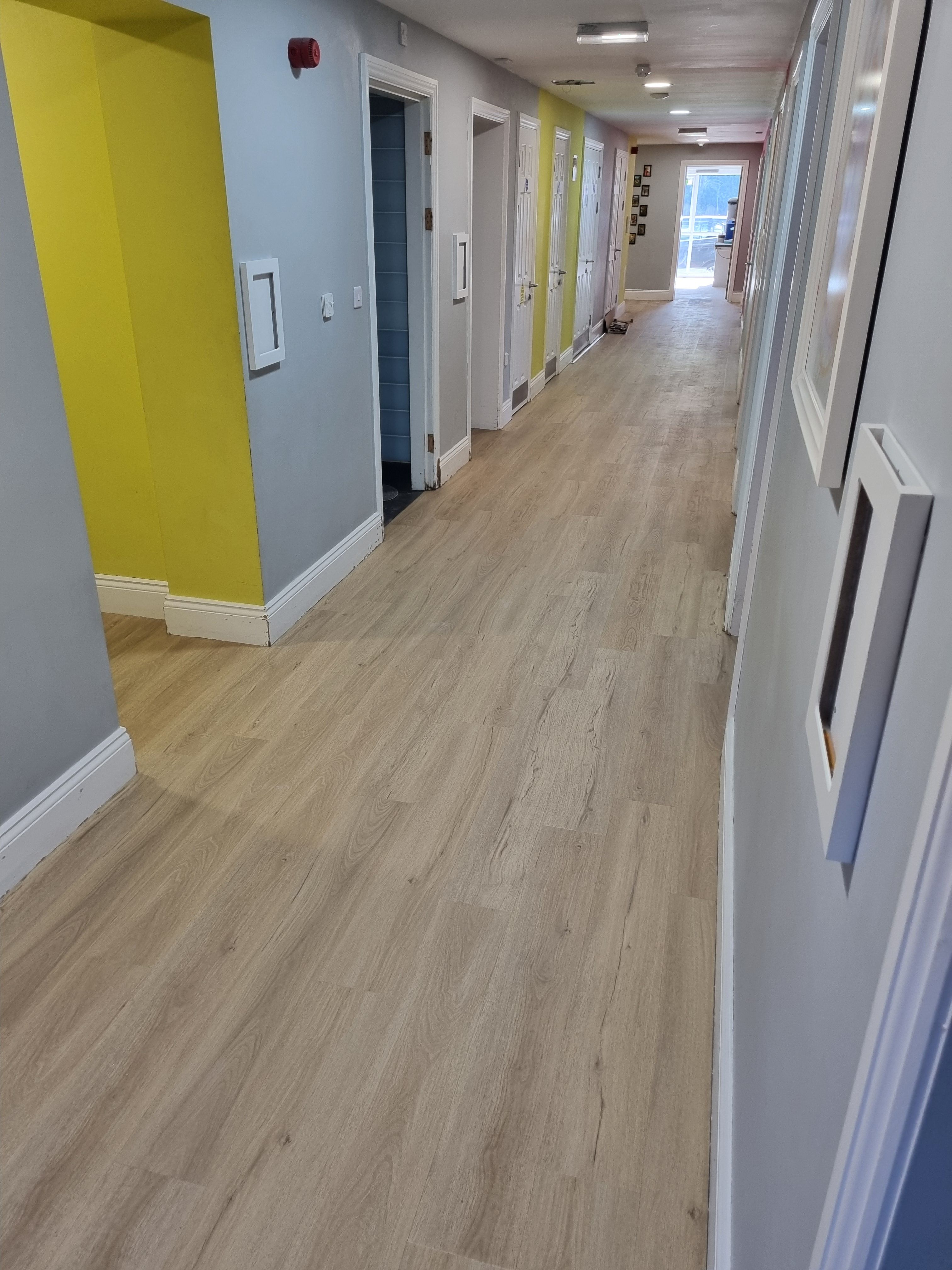 Finished commercial hallway with professional flooring
