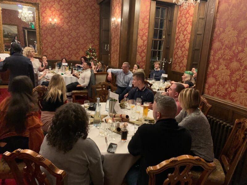Corporate quiz night with teams competing at tables, hosted by Event Collection UK
