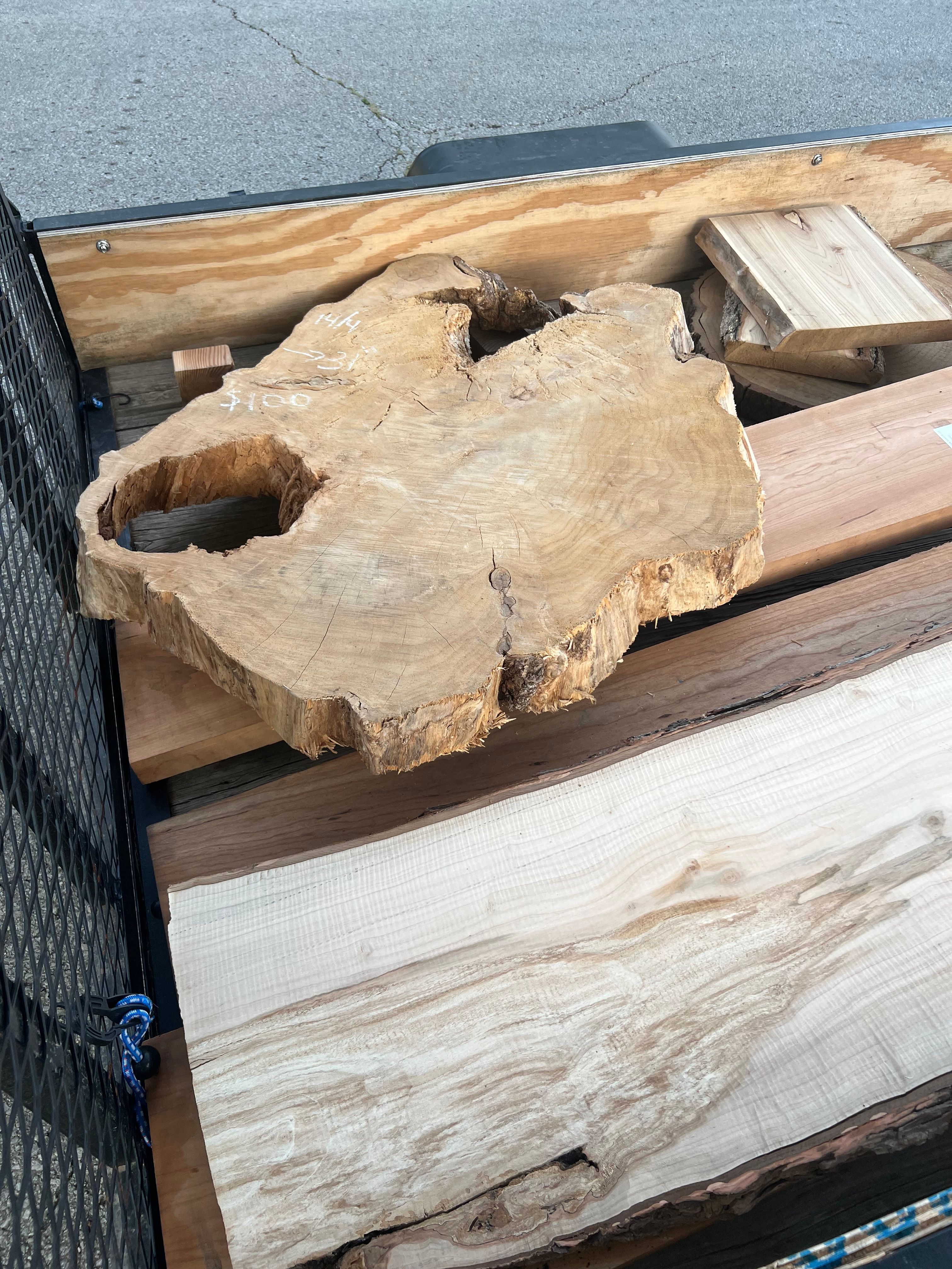 Raw wood slabs loaded on trailer for transport