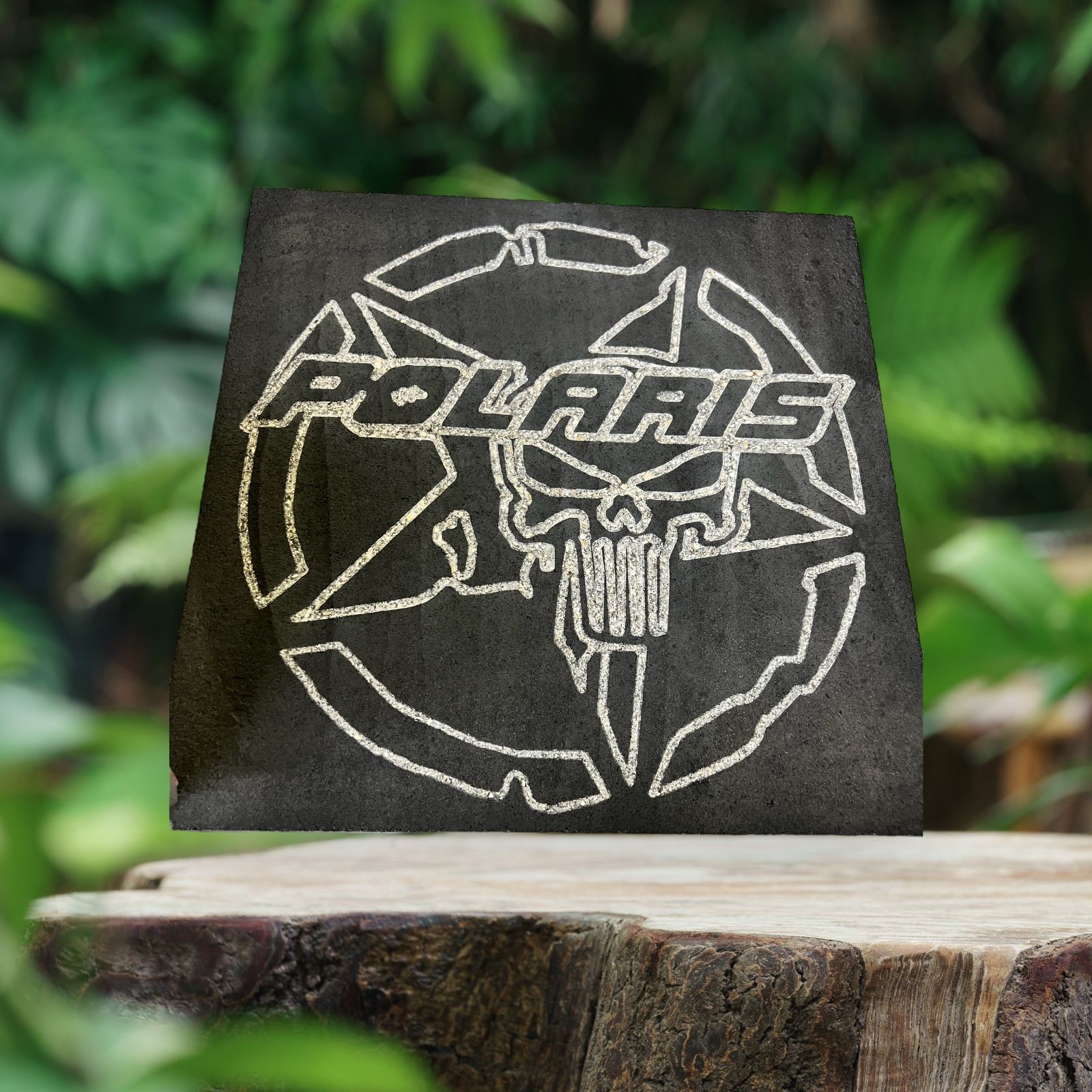 Polaris skull logo engraved on concrete