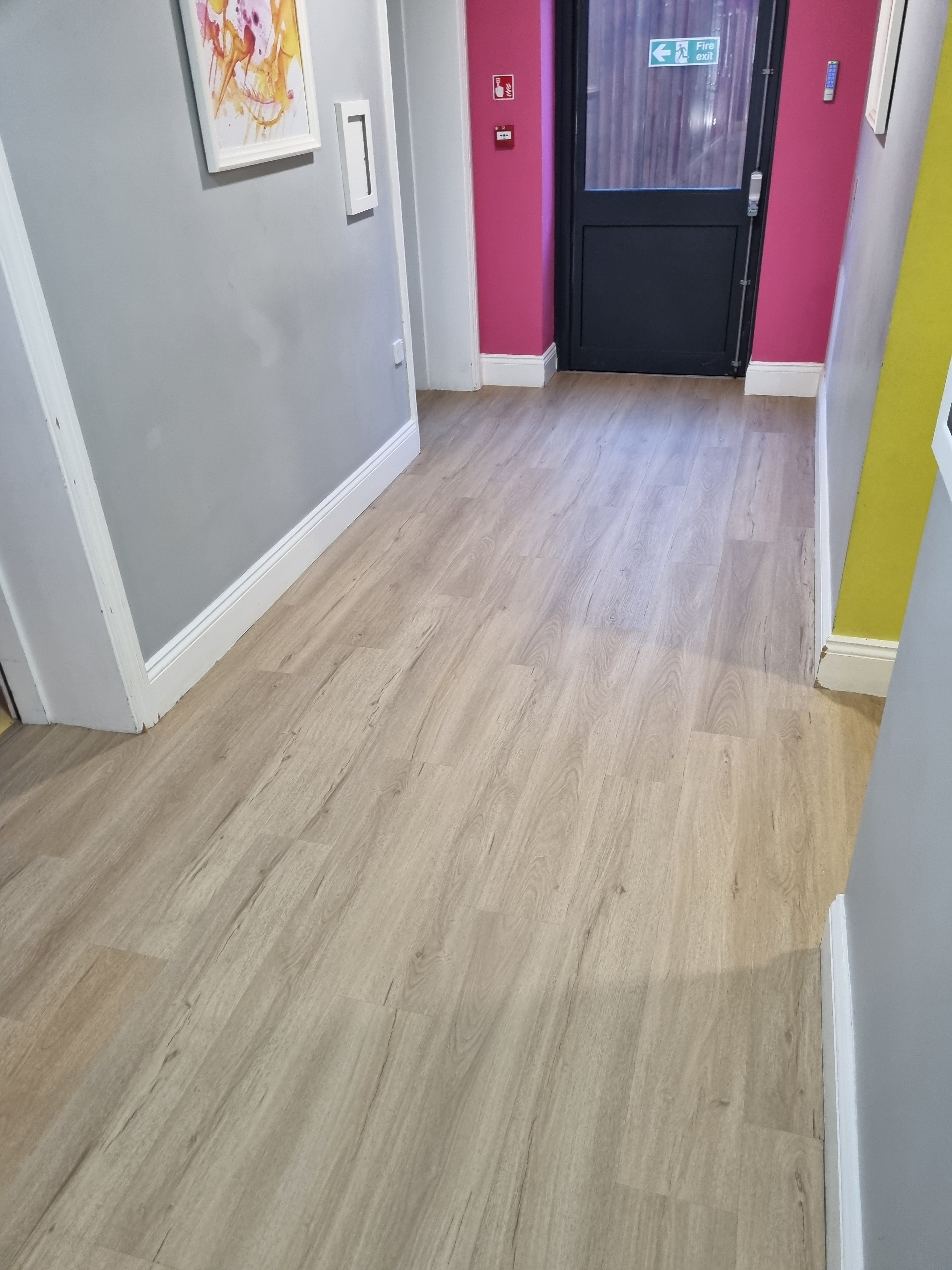 Commercial hallway with LVT flooring professionally installed