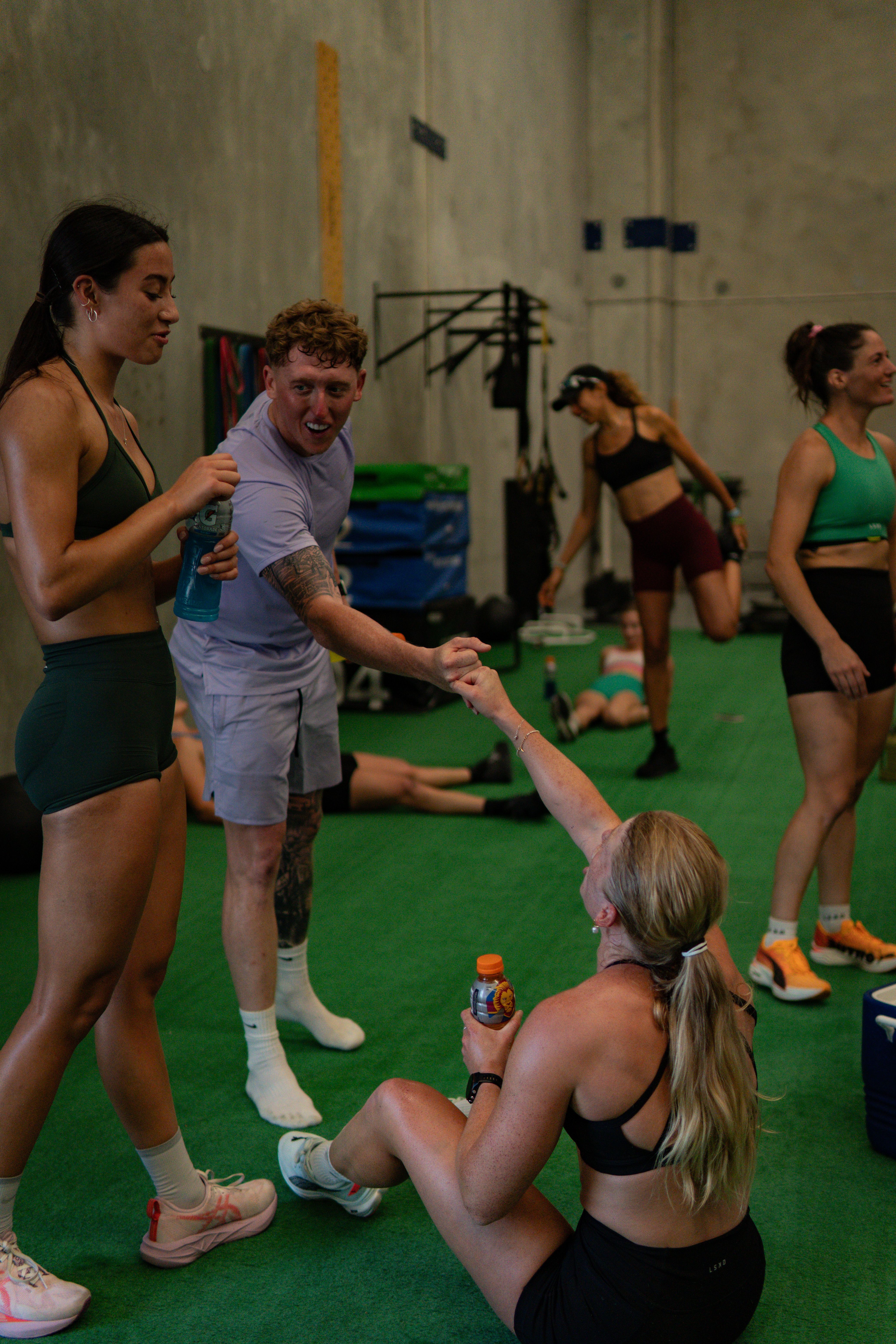 Coach Shep connecting with athletes in the gym