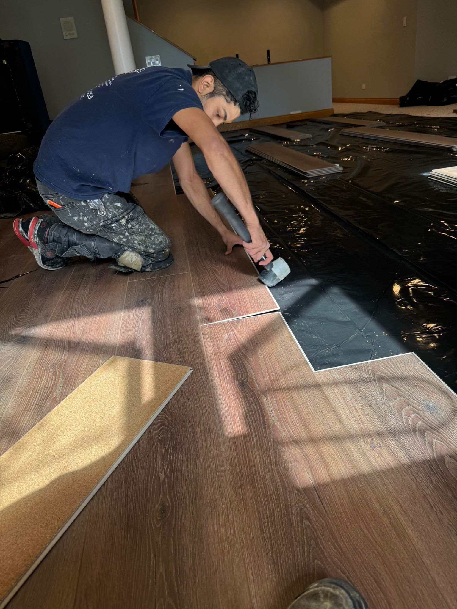 Ramos Wood Floors LLC team working on a hardwood floor installation project in Rockford IL