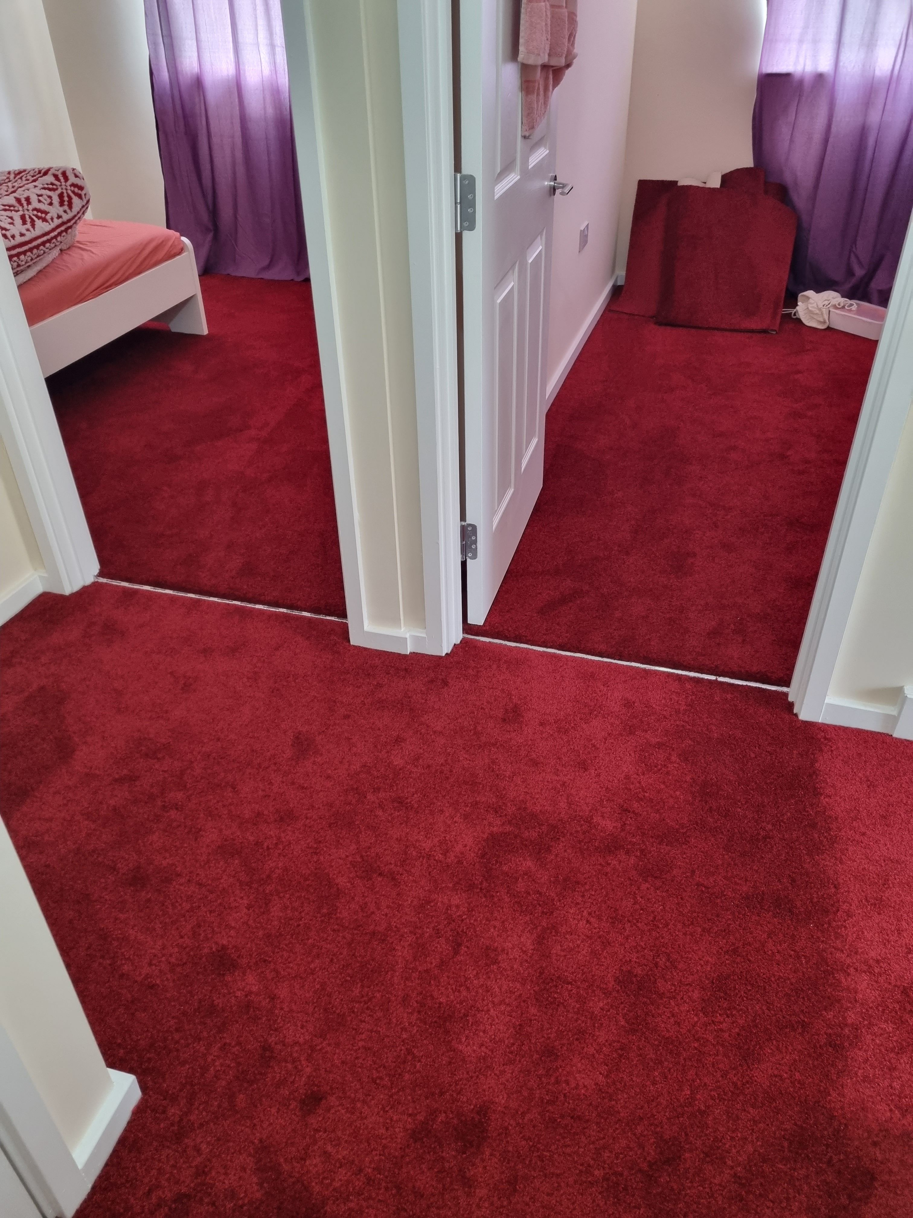 Beautiful red carpet fitted in hallway and bedrooms