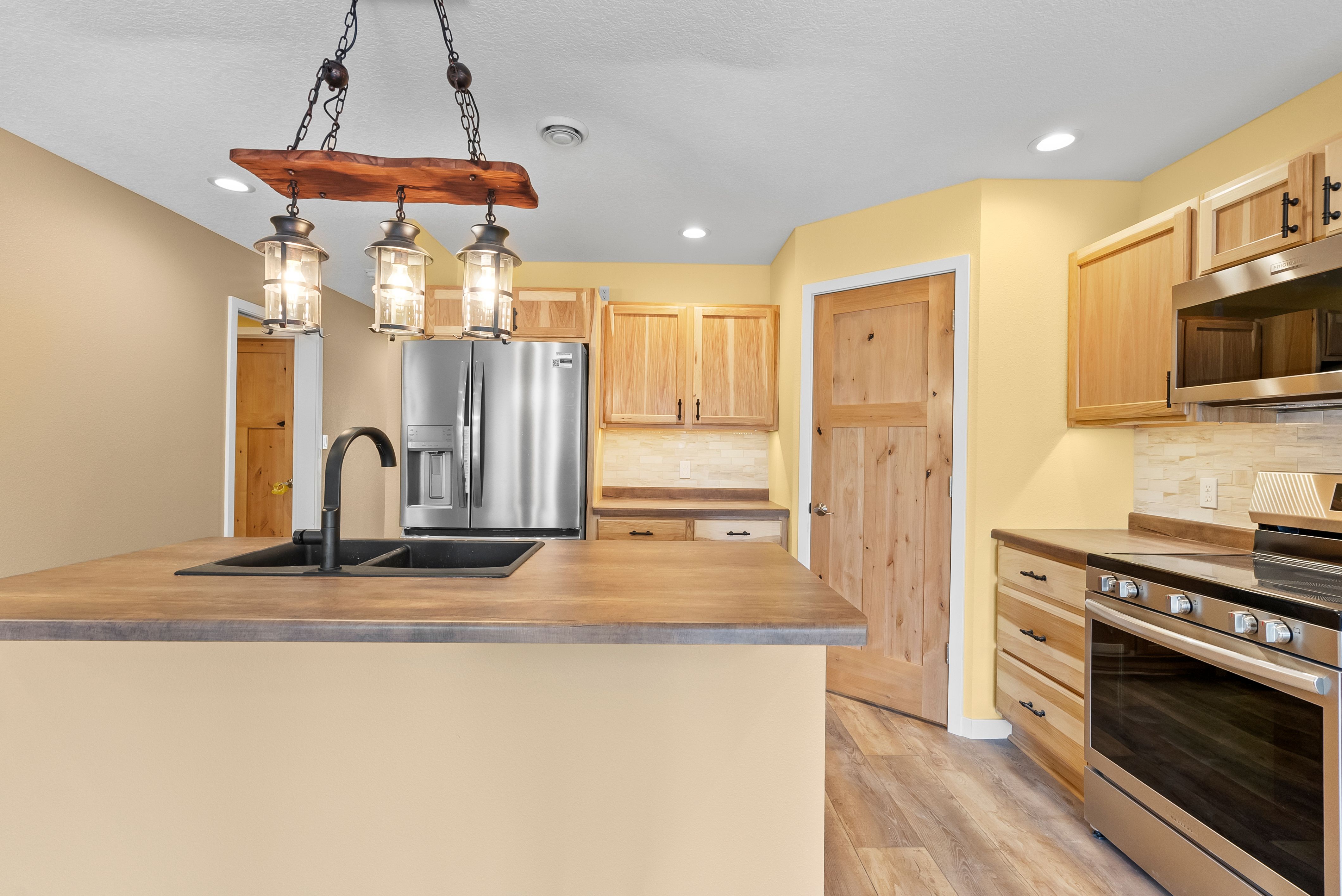 Modern kitchen remodel with island and pendant lighting